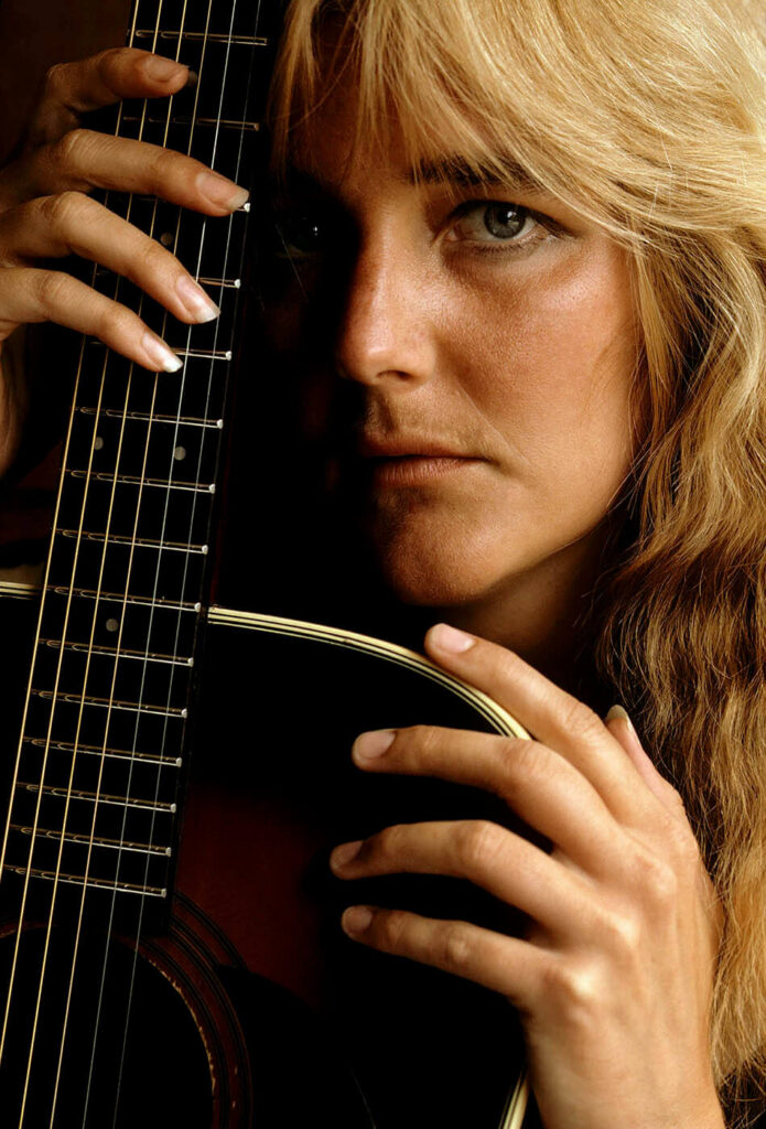 Portrait of an artist with her guitar.  Portrait photography by Craig Lovell