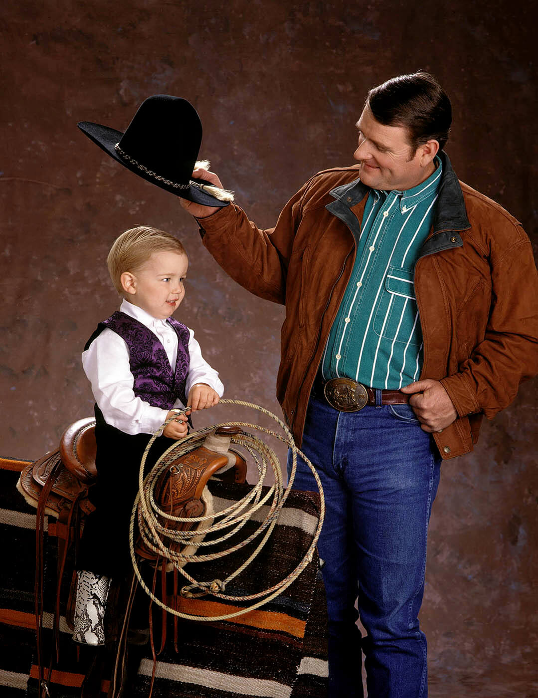 A family portrait of a father and son taken at Eagle Visions photography studio.