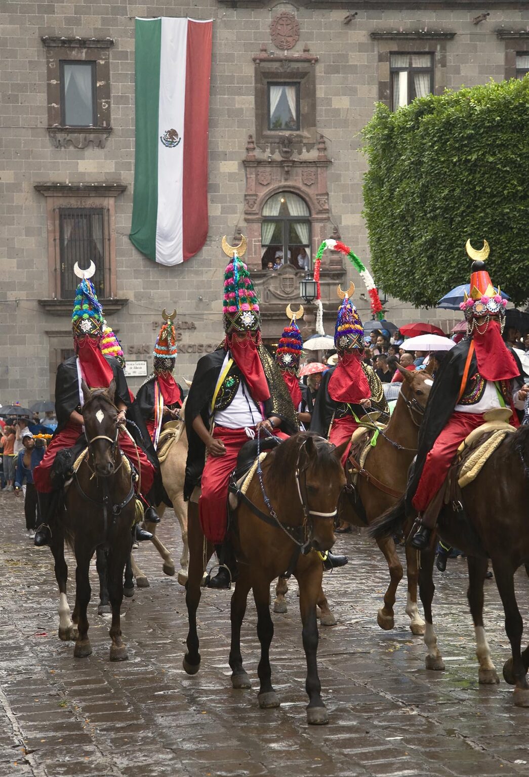 HORSEMEN with elaborate HATS & COSTUMES rides in the FESTIVAL DE SAN MIGUEL ARCHANGEL PARADE - SAN MIGUEL DE ALLENDE, MEXICO