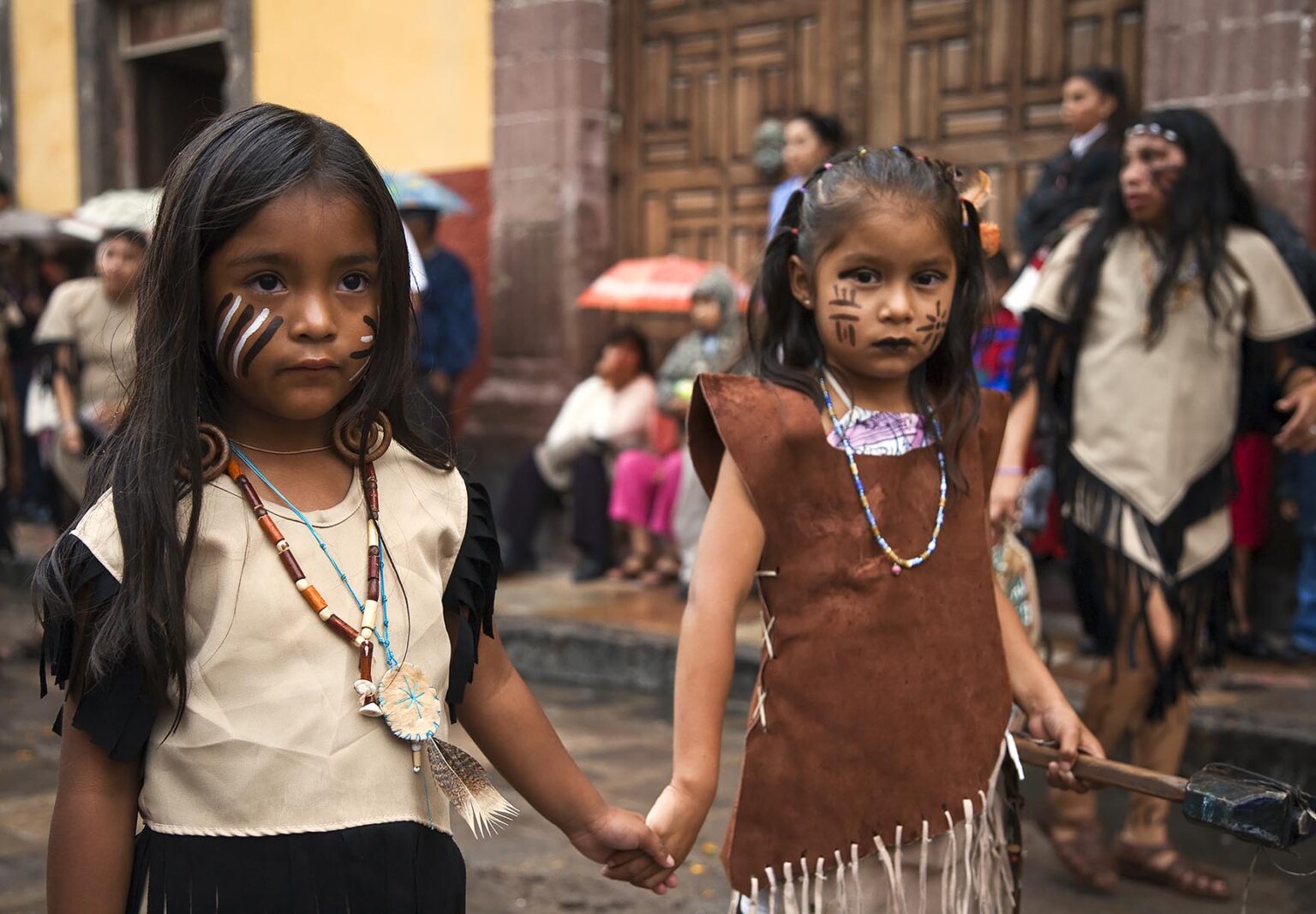 MEXICAN GIRLS in AZTEC INDIAN COSTUMES honor their heritage in the FESTIVAL DE SAN MIGUEL ARCHANGEL PARADE - SAN MIGUEL DE ALLENDE, MEXICO