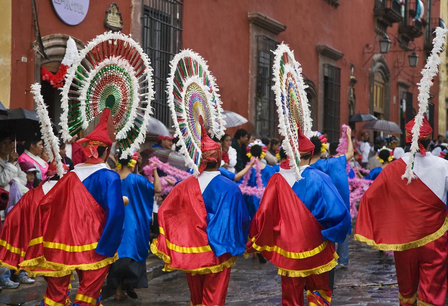 MEXICANS in traditional COSTUMES participate in the FESTIVAL DE SAN MIGUEL ARCHANGEL PARADE - SAN MIGUEL DE ALLENDE, MEXICO