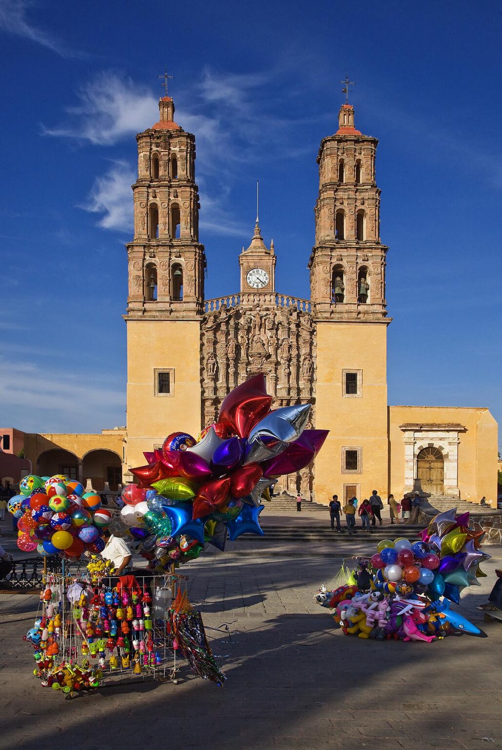 BALLOONS are sold in front of the DOLORES HIDALGO CATHEDRAL built in the 16th century - GUANAJUATO, MEXICO