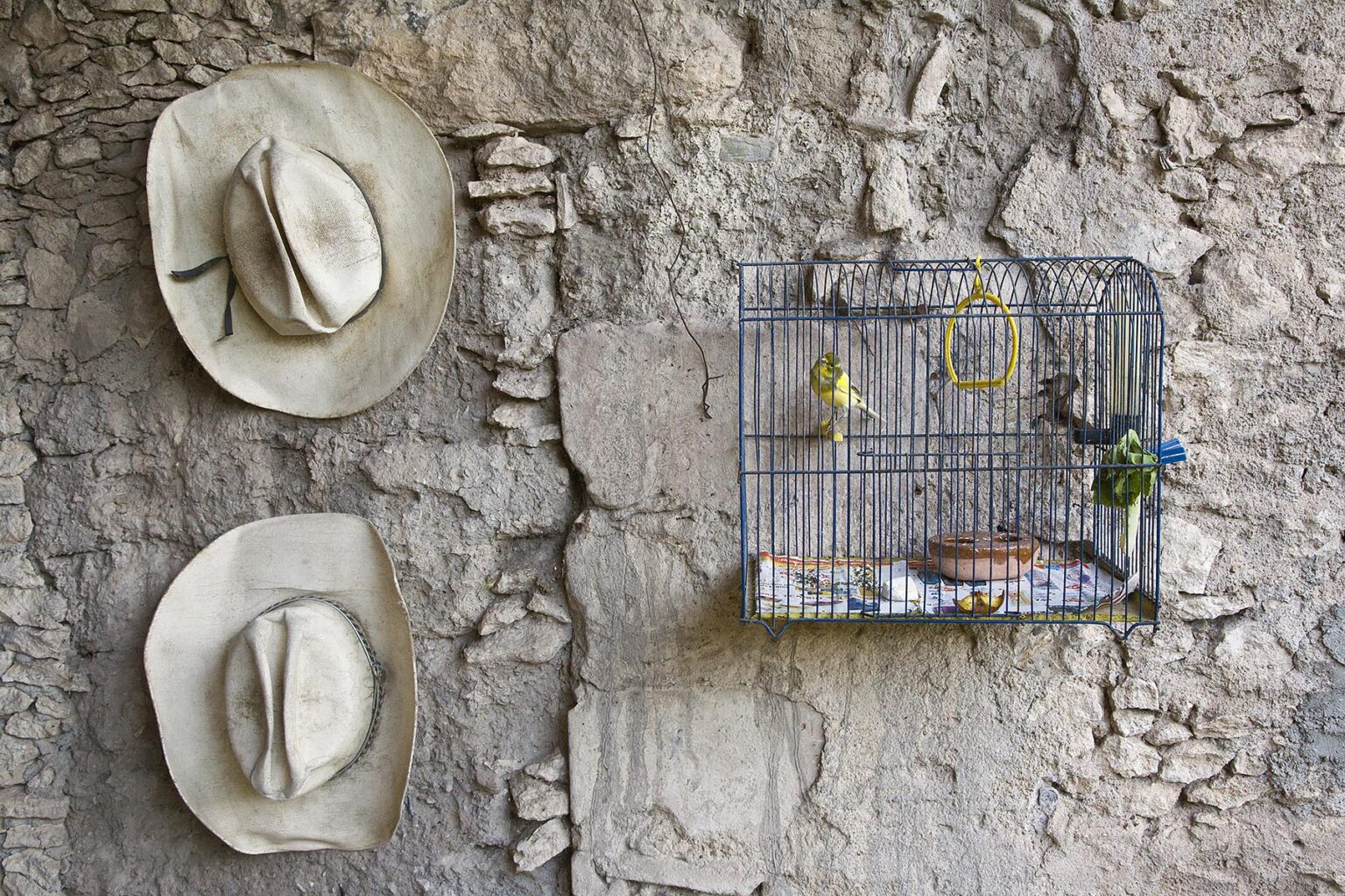 COWBOY HATS and BIRD CAGE in the ghost town of MINERAL DE POZOS - GUANAJUATO, MEXICO