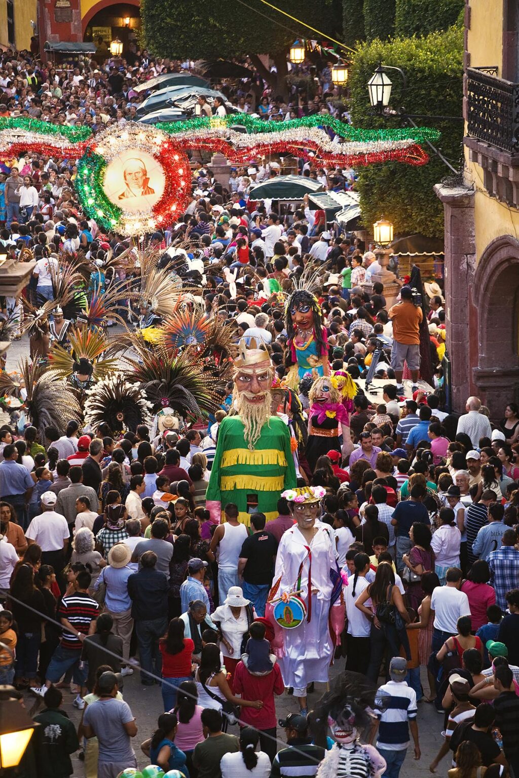 GIANT PAPER MACHE STILT WALKERS, DANCERS and the crowd at the annual INDEPENDENCE DAY PARADE in September - SAN MIGUEL DE ALLENDE, MEXICO
