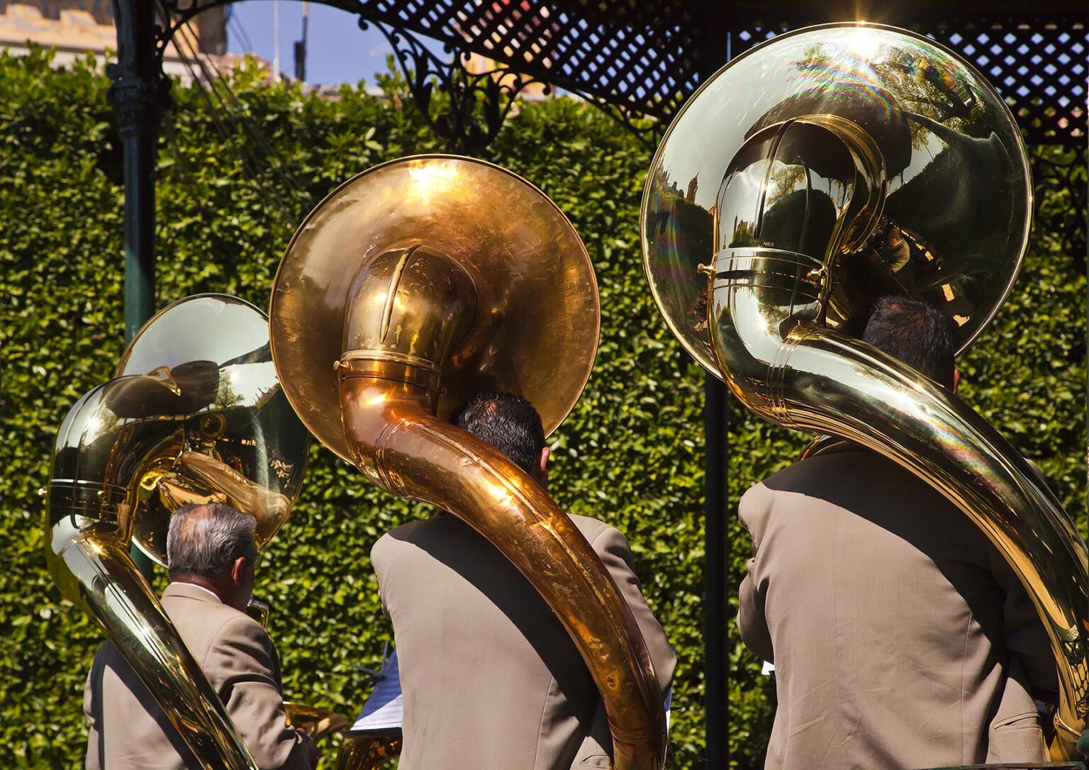 A brass band with three TUBA players preforms in the central square - GUANAJUATO, MEXICO