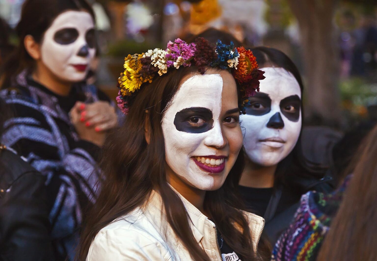 Faces are painted like skulls as people transform themselves into CATRINAS during DAY OF THE DEAD  -  SAN MIGUEL DE ALLENDE, MEXICO