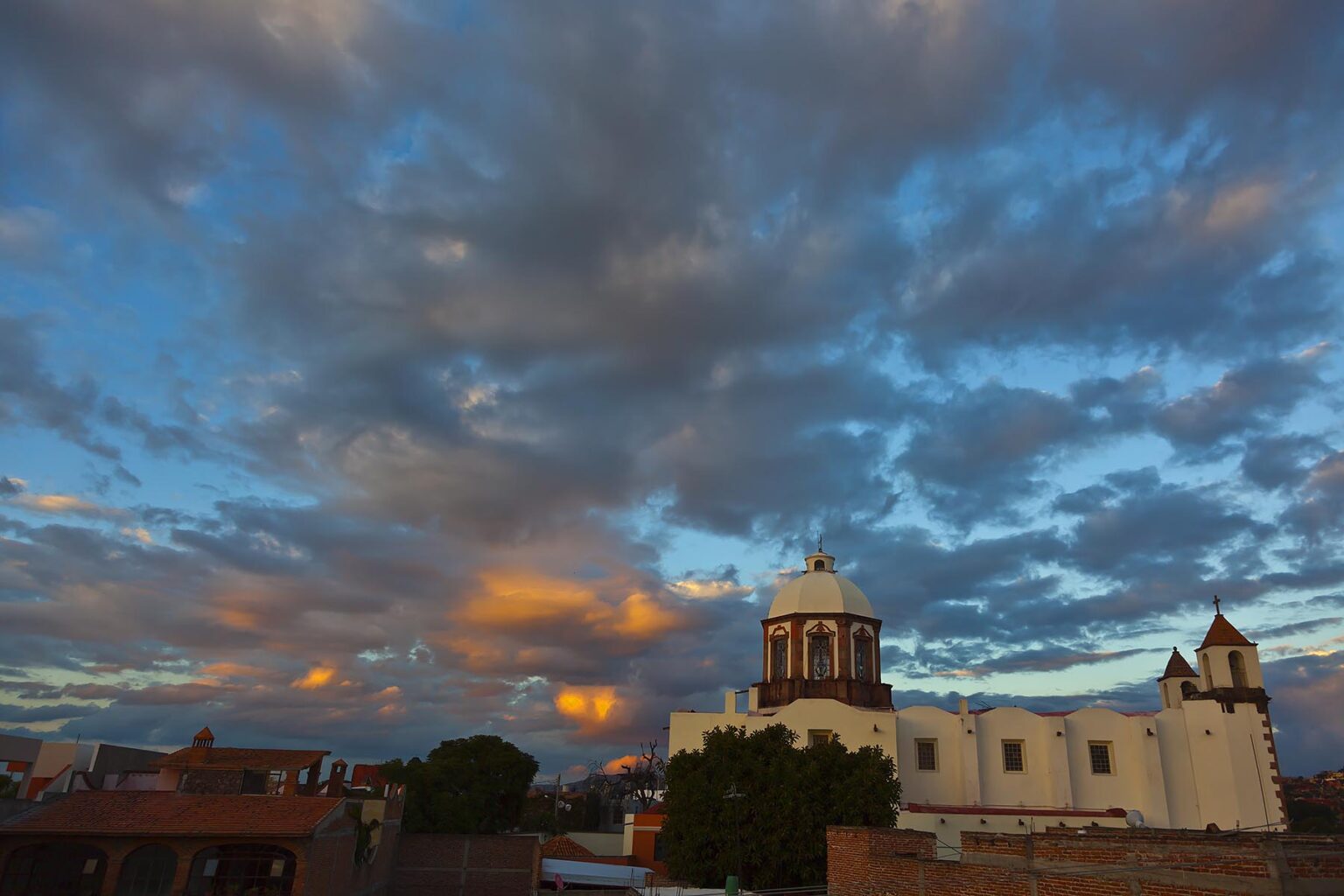 A magnificent SUNSET over the SAN ANTONIO CHURCH in SAN MIGUEL DE ALLENDE - MEXICO