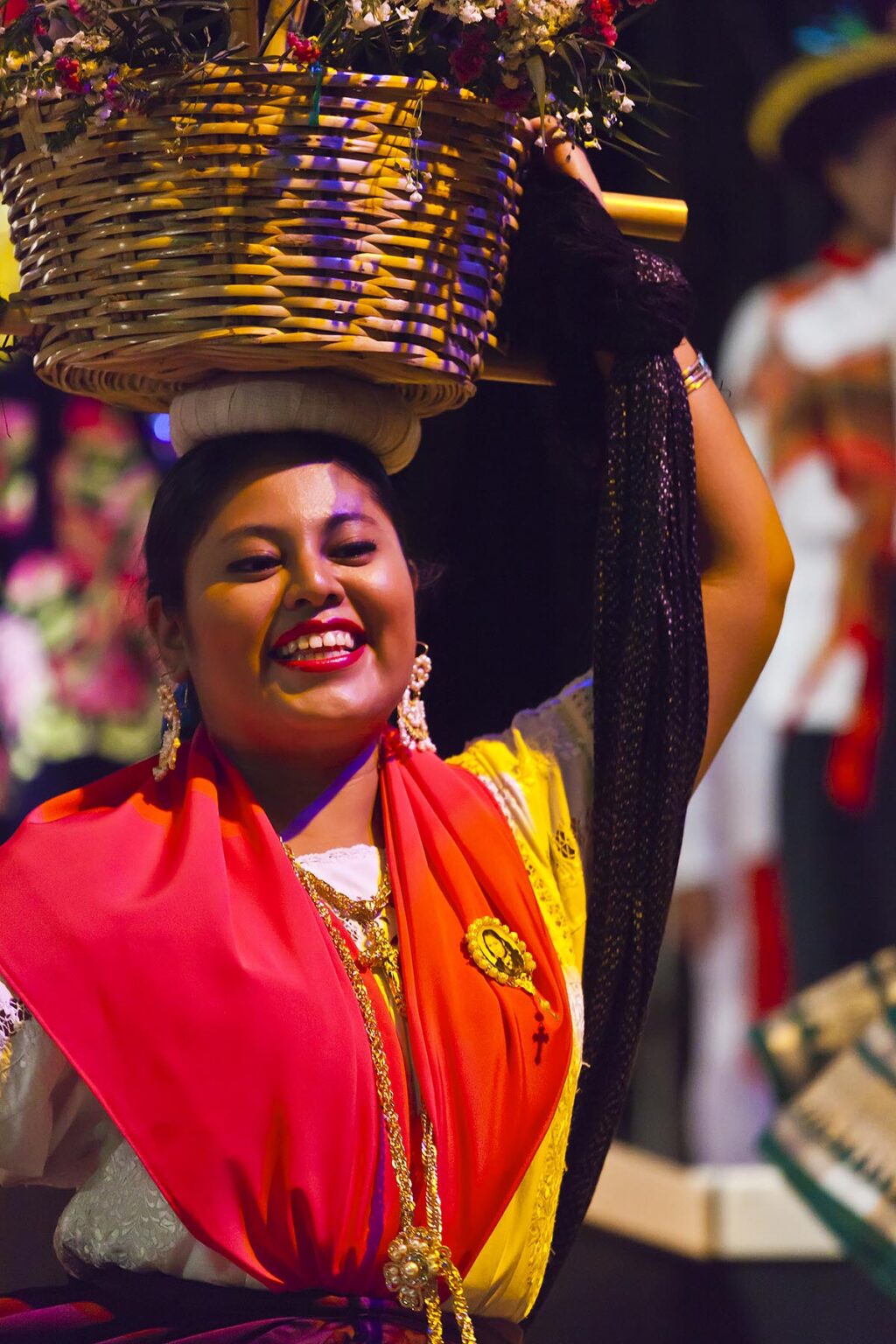 A female FOLK DANCER performs in the Plaza de la Danza during the GUELAGUETZA FESTIVAL in July - OAXACA, MEXICO
