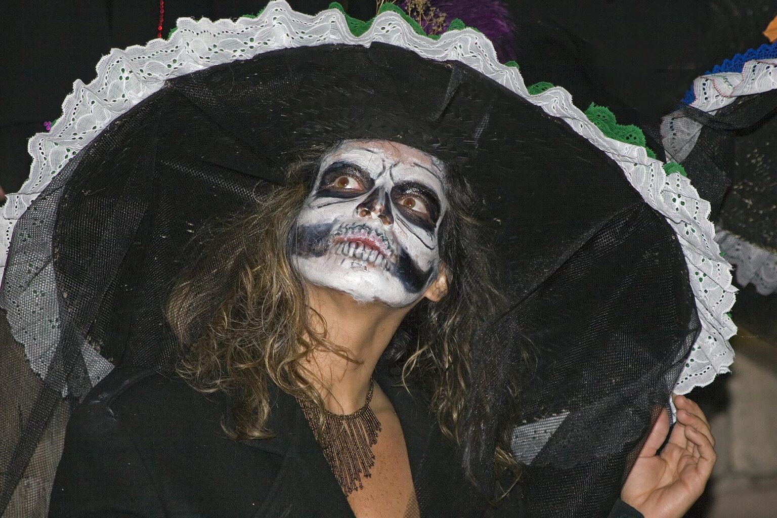 Adults dress up as skeletons and distribute candy to Mexican children during the DEAD OF THE DEAD - SAN MIGUEL DE ALLENDE, MEXICO