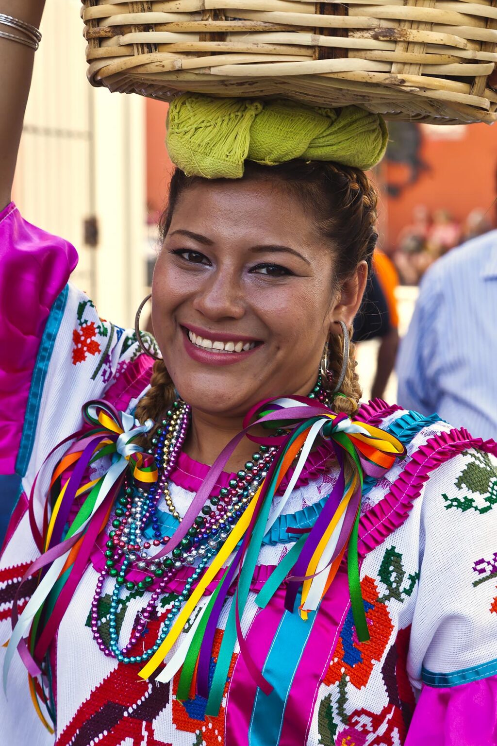 A traditionally dressed Mexican woman in a parade during the July GUELAGUETZA FESTIVAL  - OAXACA, MEXICO