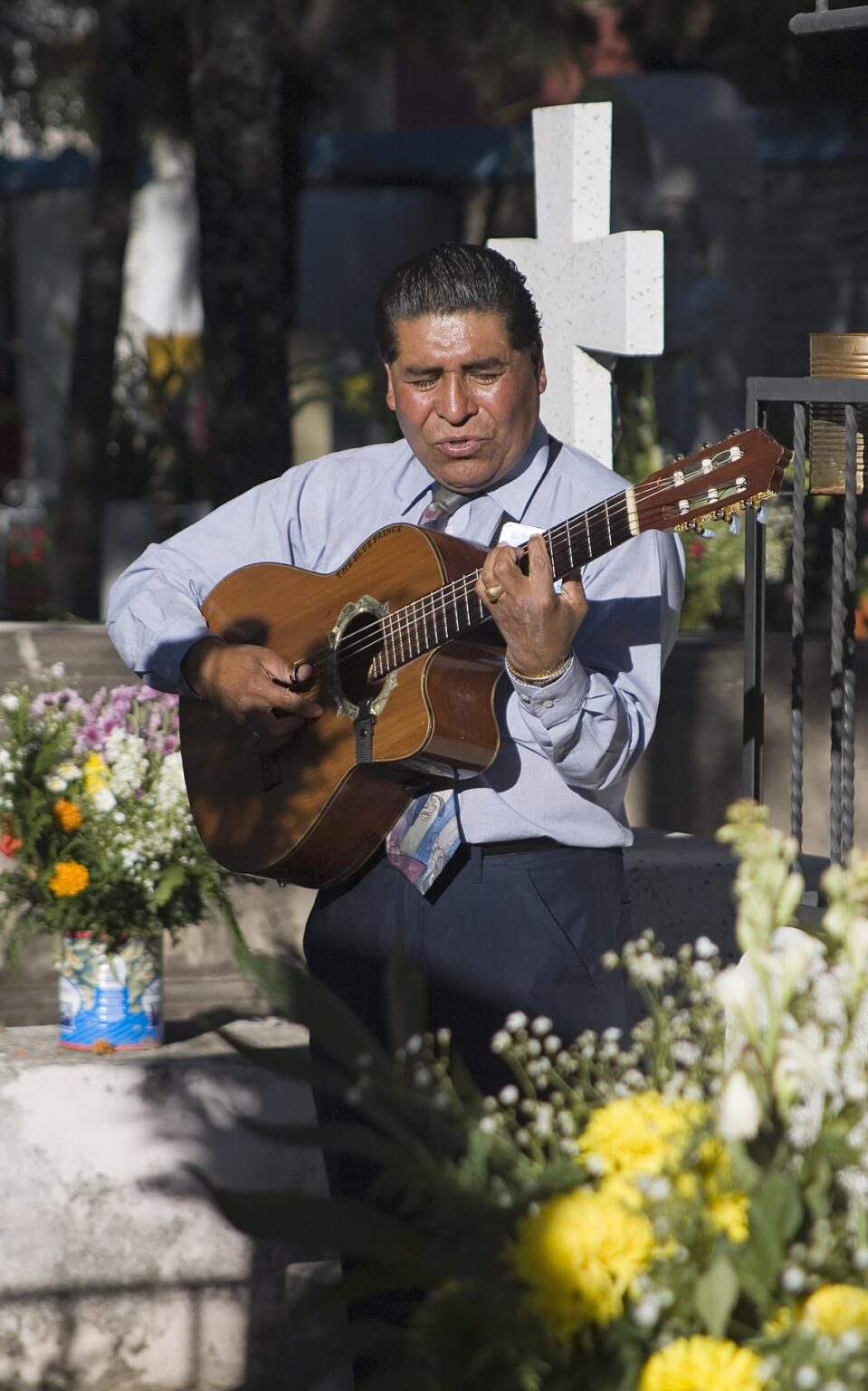 A GUITARIST plays for the dead at the local cemetery during the DEAD OF THE DEAD - SAN MIGUEL DE ALLENDE, MEXICO
