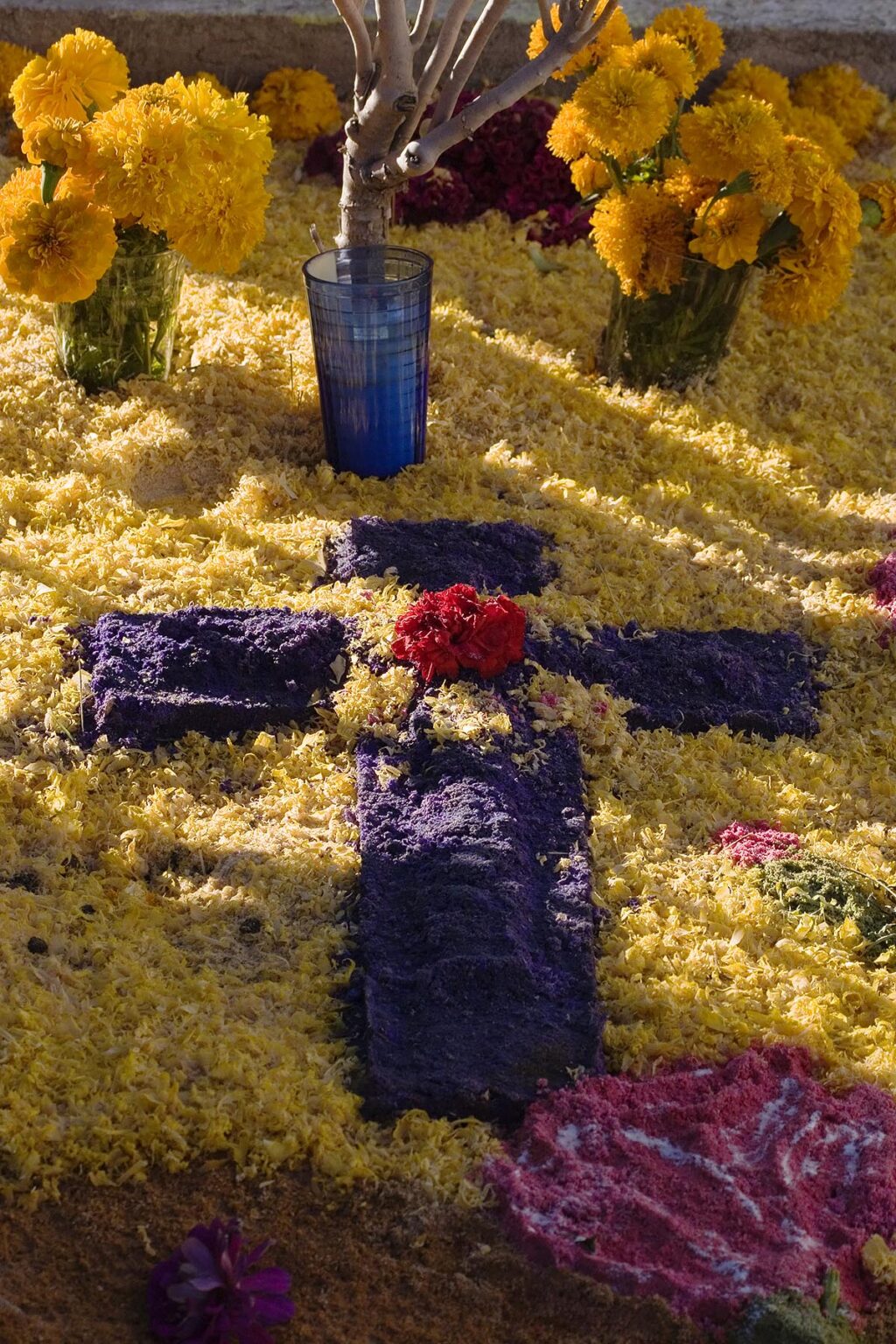 A FLOWER covered grave at the local cemetery during the DEAD OF THE DEAD - SAN MIGUEL DE ALLENDE, MEXICO