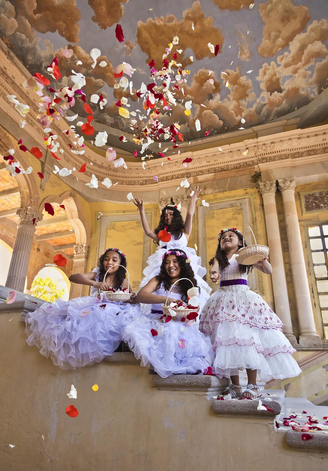 Young Mexican girls dressed in their Easter best throw rose petals at Jaral de Berrio - SAN FELIPE, MEXICO