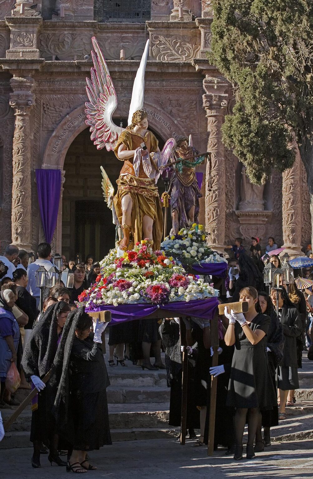 MEXICAN WOMEN carry an angel from TEMPLO DEL ORATORIO DE SAN FELIPE NERI during EASTER PROCESSION - SAN MIGUEL DE ALLENDE, MEXICO