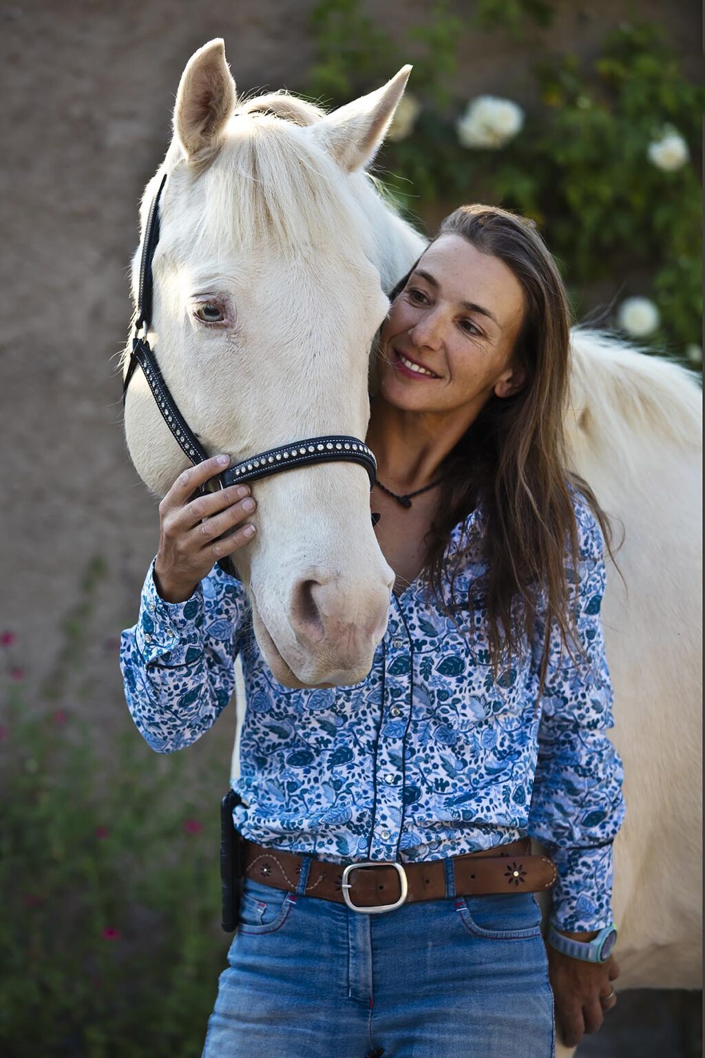 Katja Smith with a rare white horse at Granitas de Animas Ranch - SAN MIGUEL DE ALLENDE, MEXICO