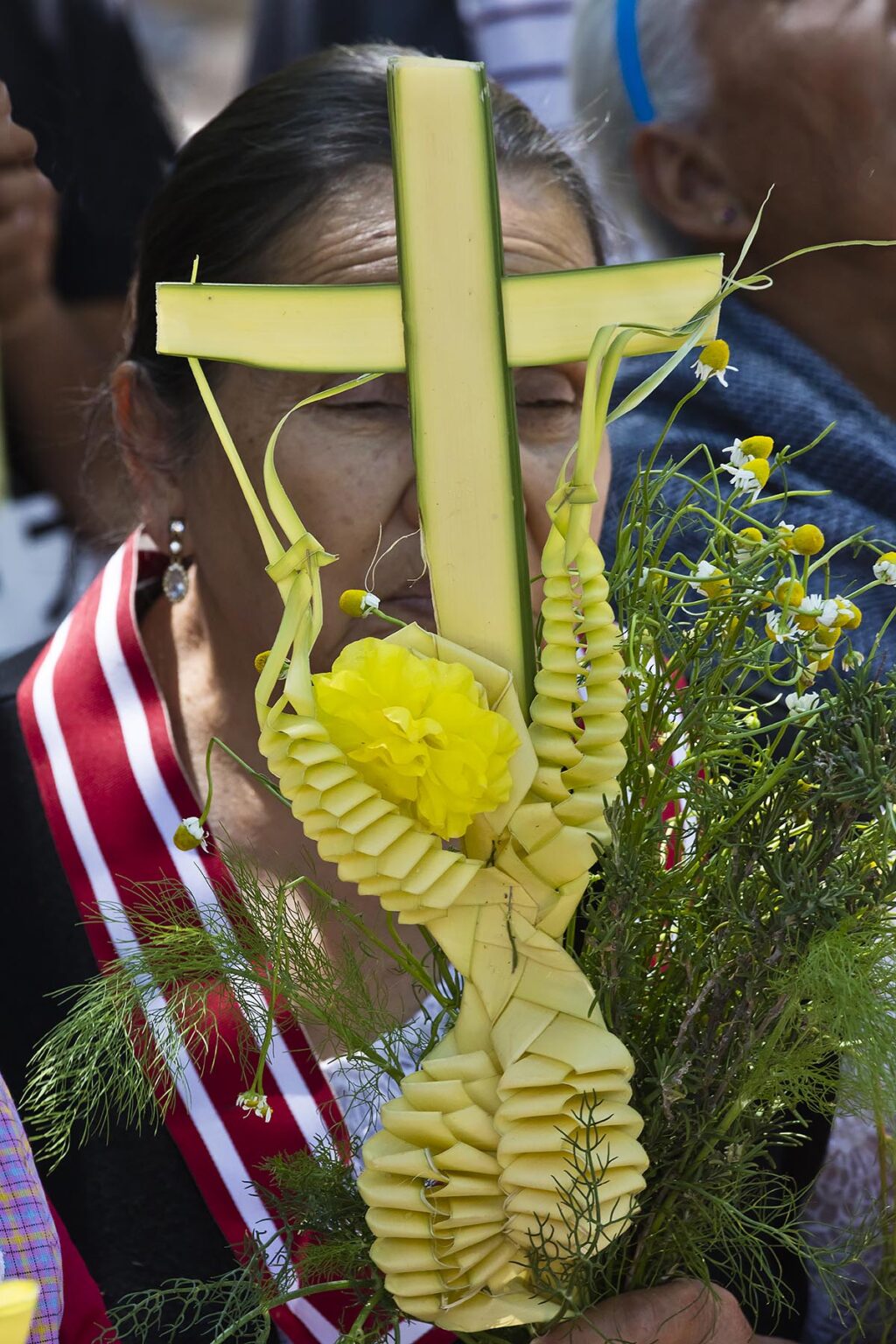 A Mexican woman participates in the PALM SUNDAY procession from Parque Juarez to the Jardin - SAN MIGUEL DE ALLENDE, MEXICO