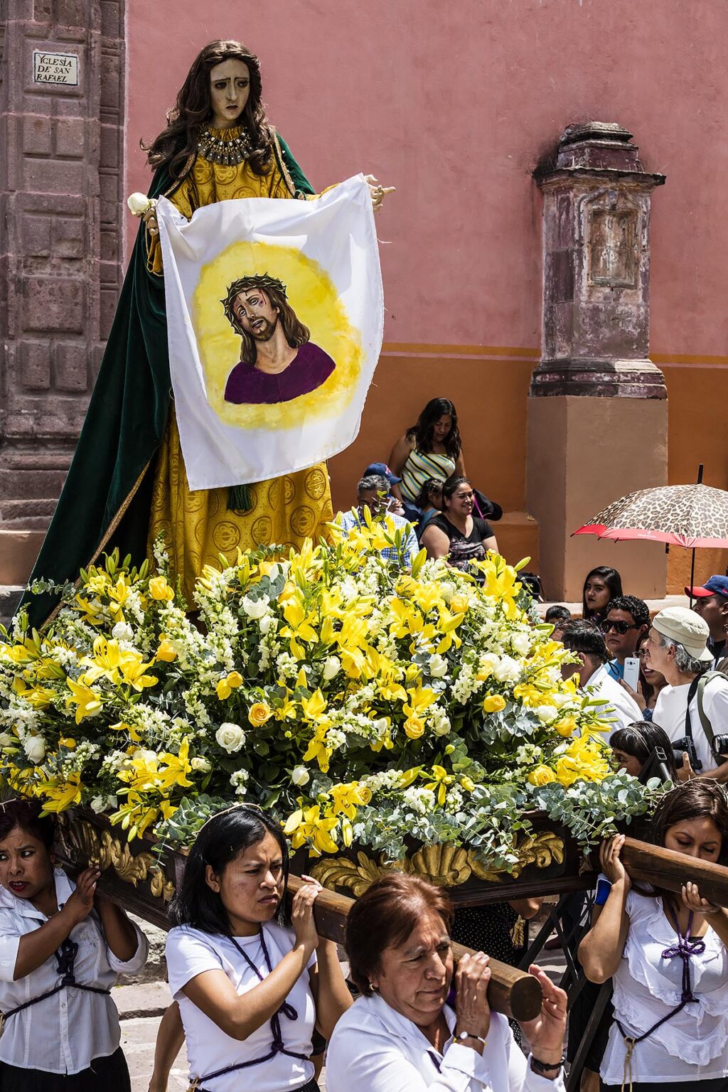 A statue of a saint is carried out of the SAN RAFAEL chapel during the Good Friday Procession called Santo Encuentro - SAN MIGUEL DE ALLENDE, MEXICO