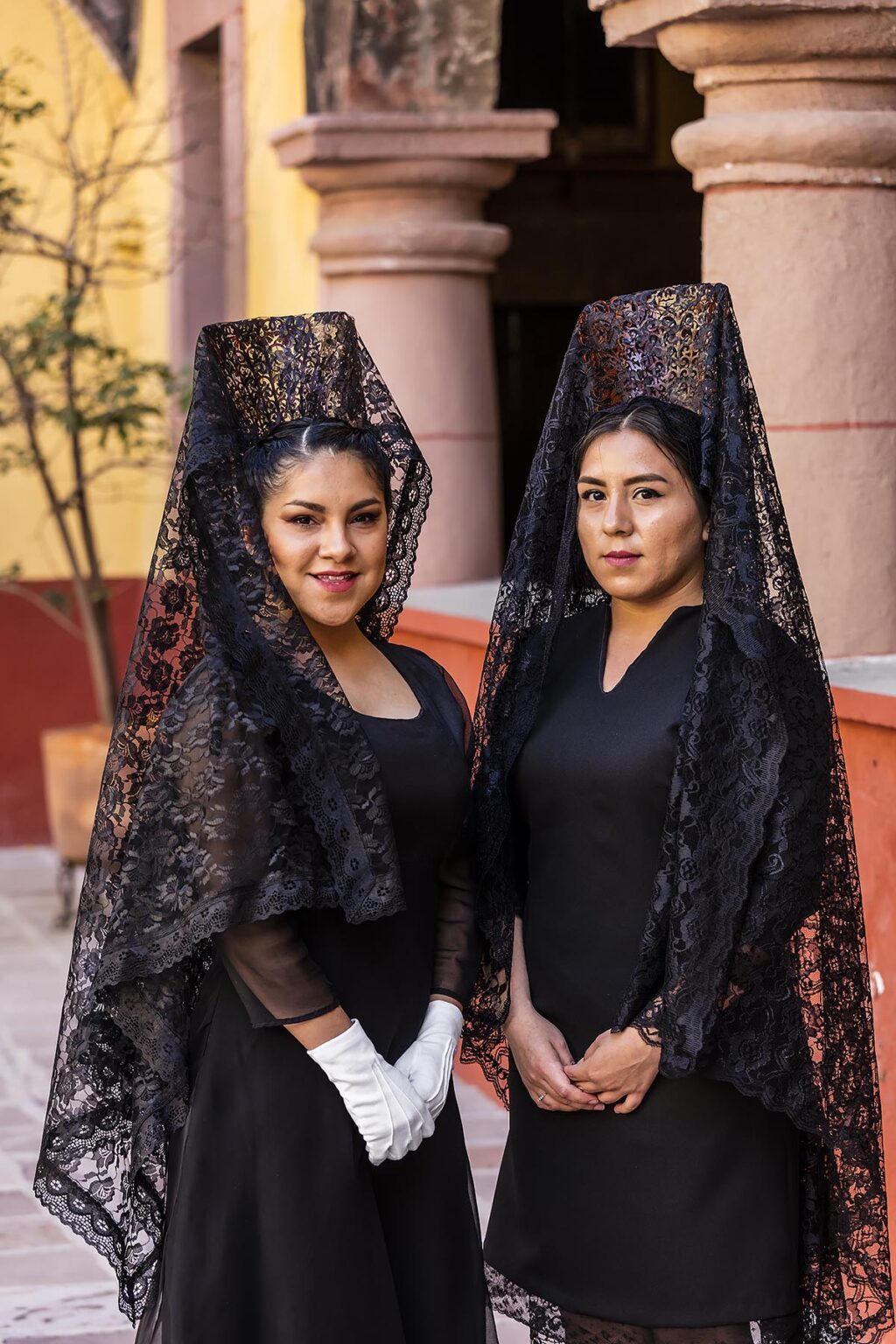 Women in traditional mantillas in the ORATORIO CHURCH courtyard get ready for the Good Friday Procession - SAN MIGUEL DE ALLENDE, MEXICO
