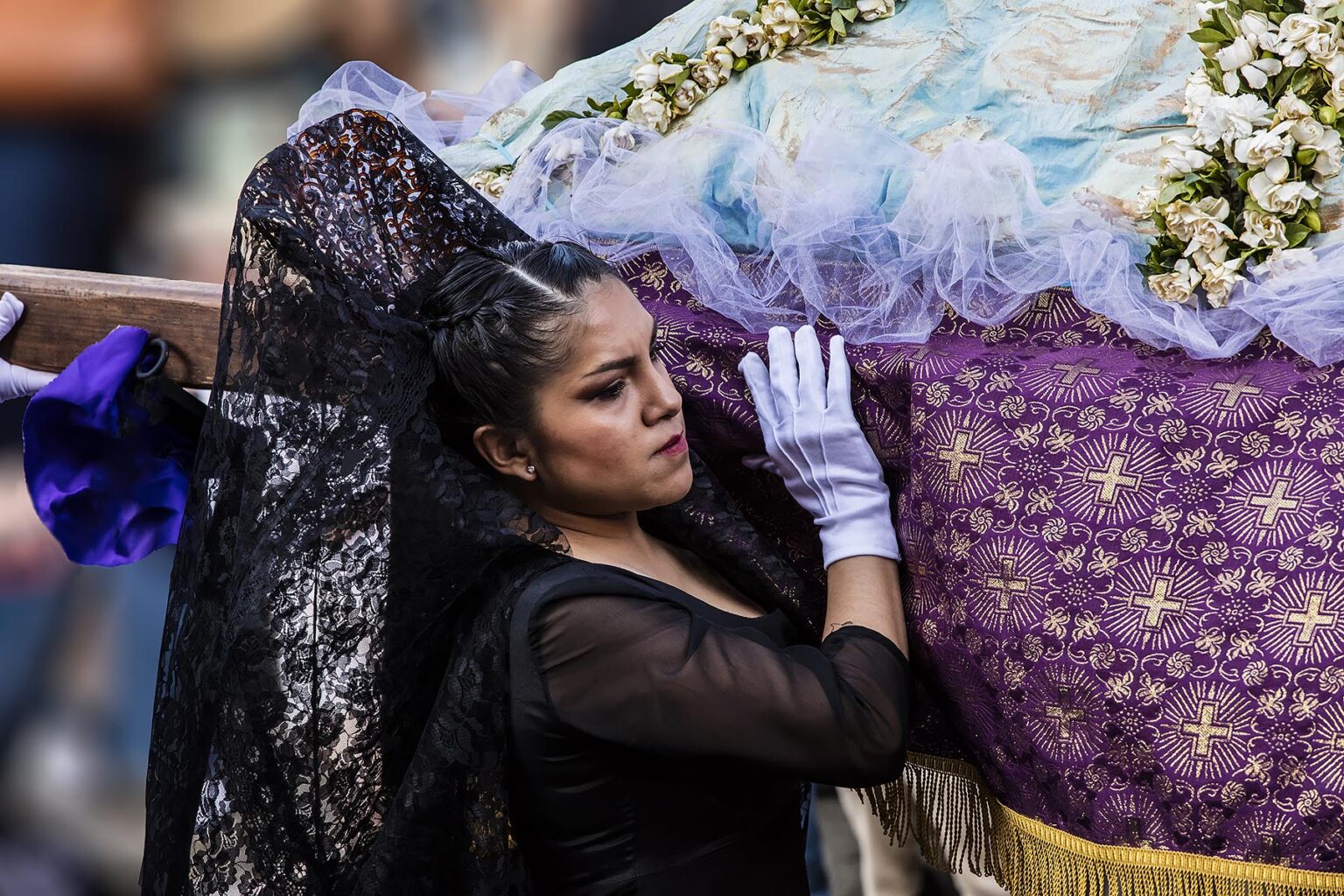 Women dressed in traditional mantillas carry religious statues in the Good Friday Procession, known as the Santo Entierro, from the ORATORIO CHURCH - SAN MIGUEL DE ALLENDE, MEXICO