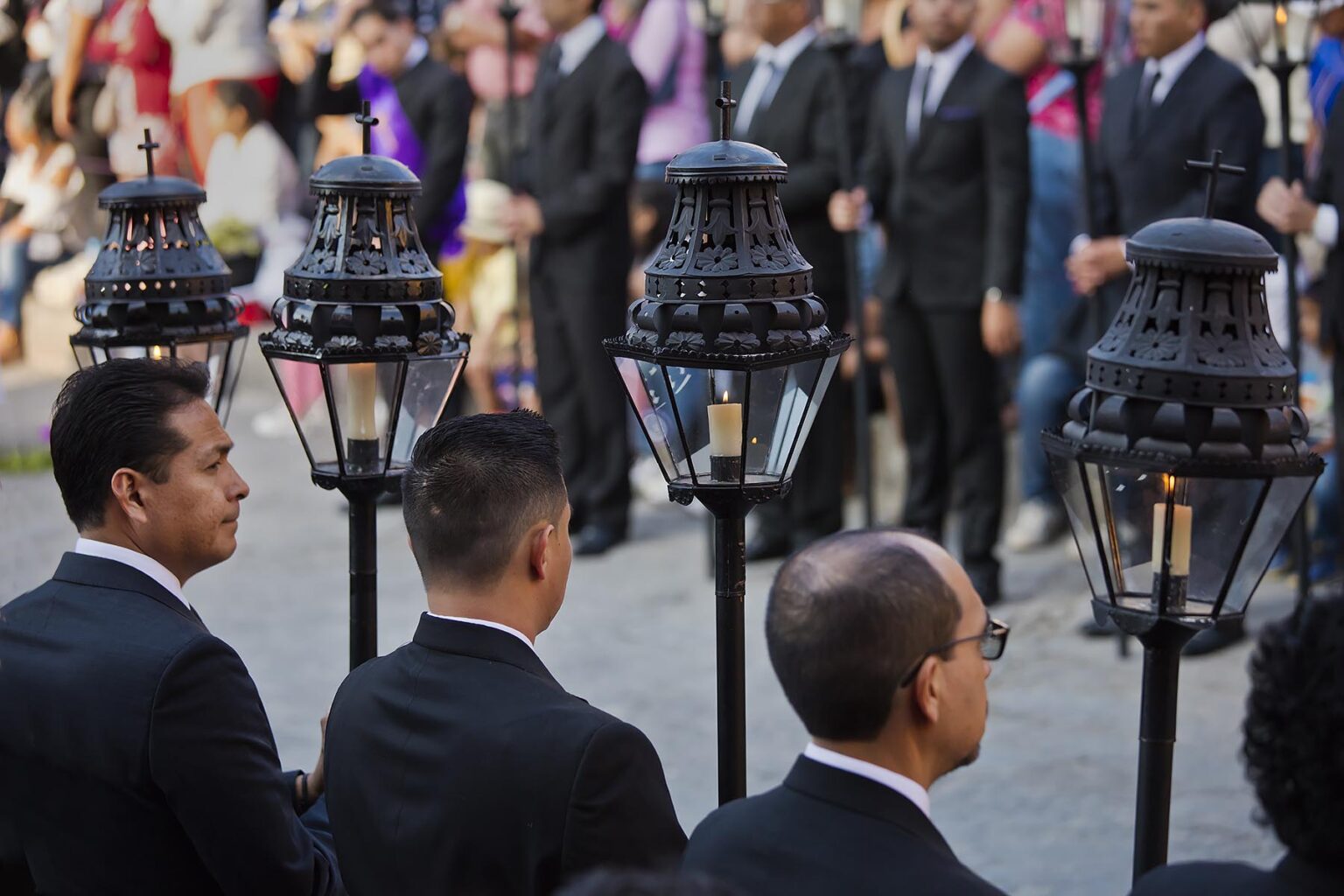 Mexican men carry candle lanterns in the Good Friday Procession, known as the Santo Entierro, from the ORATORIO CHURCH - SAN MIGUEL DE ALLENDE, MEXICO
