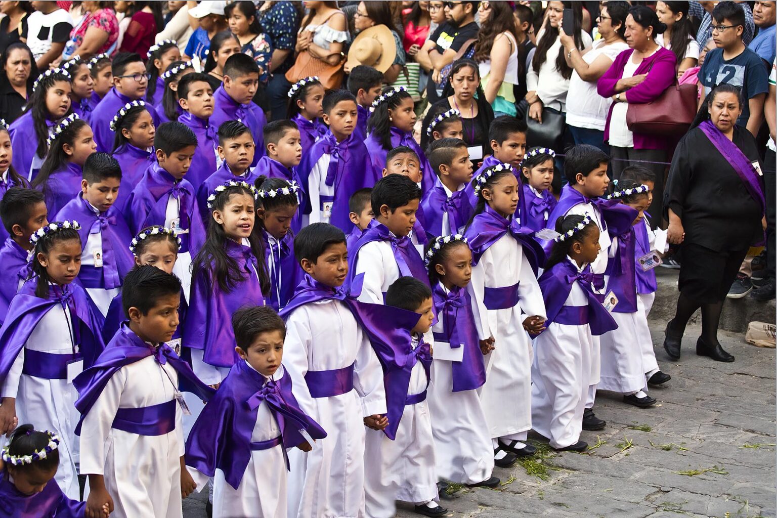 Mexican girls dresses as angels walk in the Good Friday Procession, known as the Santo Entierro, at the ORATORIO CHURCH - SAN MIGUEL DE ALLENDE, MEXICO
