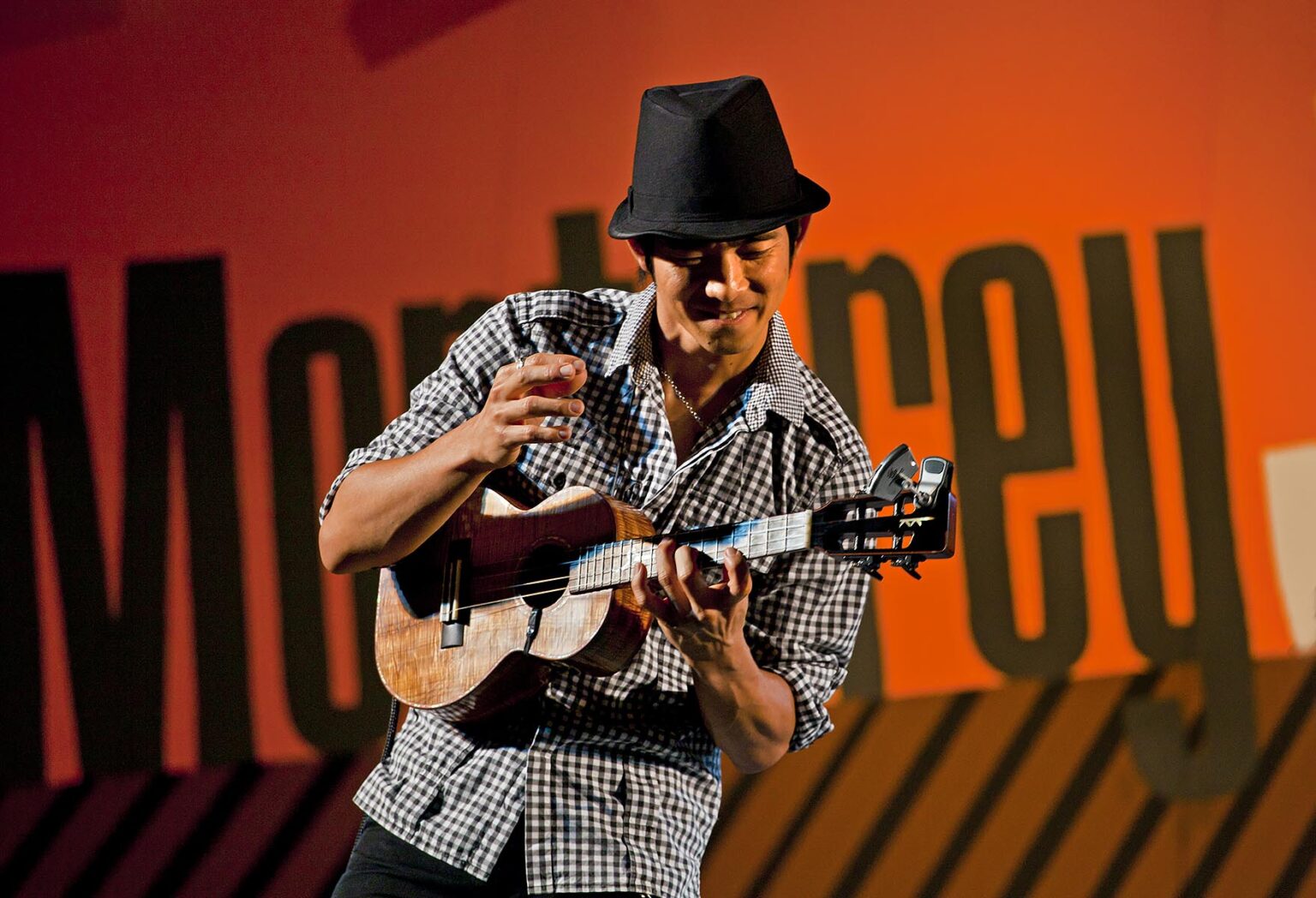 JAKE SHIMABUKURO plays guitar and sings on the Garden Stage - 2010 MONTEREY JAZZ FESTIVAL, CALIFORNIA