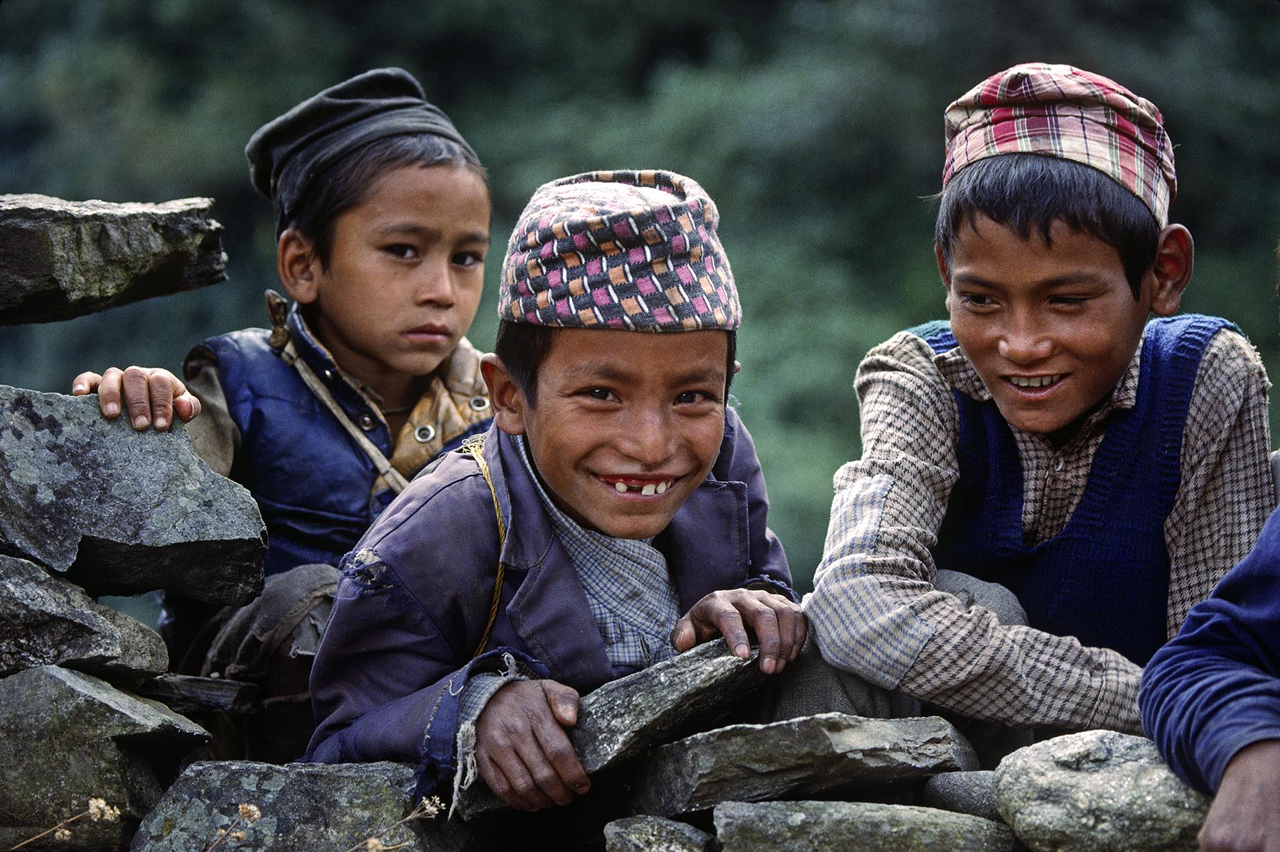 Chetri boys on a village wall - SOLU TREK, NEPAL