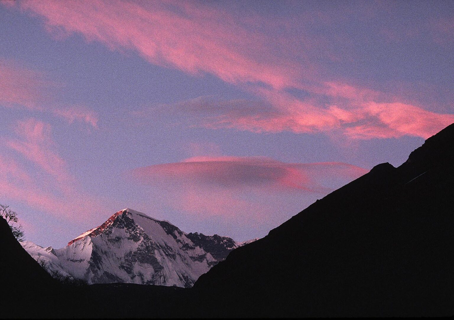 The sun sets on Cho Oyu (26,906 feet); 1 of 14 mountains in the world higher than 8,000 Meters - KHUMBU DISTRICT, NEPAL