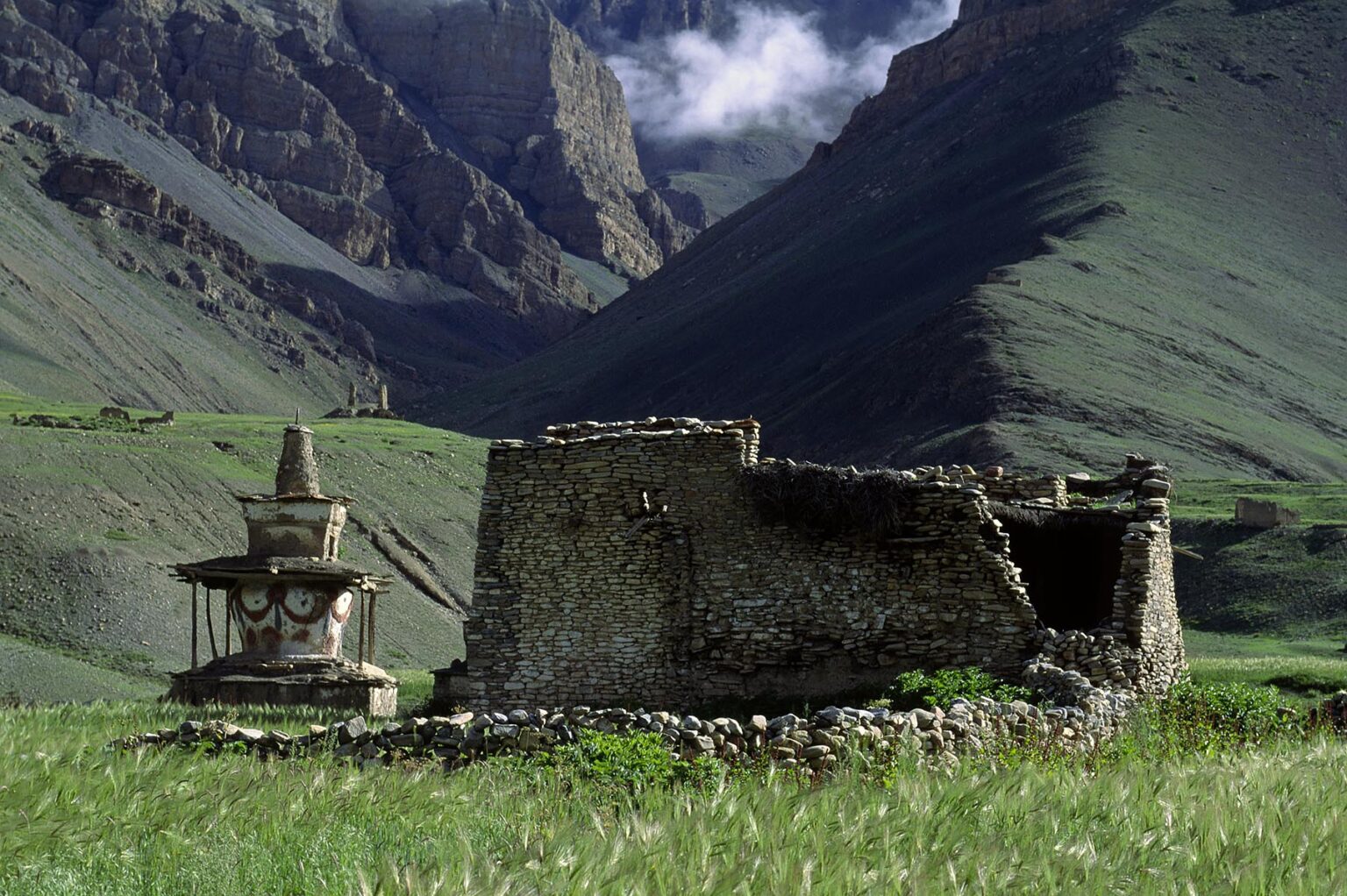 Tibetan Buddhist CHORTEN and RUINS of a farm house in the DO TARAP VALLEY - DOLPO DISTRICT, NEPAL