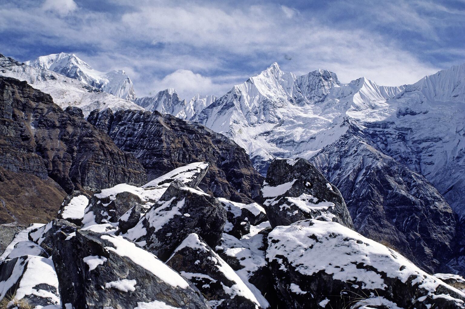 SNOWY ROCKS, barren ridges, and HIMALAYAN PEAKS including ANNAPURNA 4 - ANNAPURNA SANCTUARY,  NEPAL