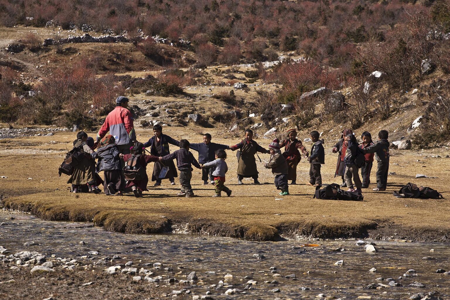 SCHOOL CHILDREN at play in the village of SAMAGAUN on the AROUND MANASLU TREK - NUPRI REGION, NEPAL
