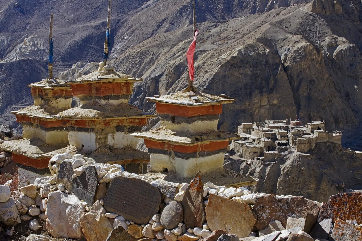 BUDDHIST CHORTENS and the TIBETAN VILLAGE of PHU which  is located in a remote valley at 4200 meters on the NAR PHU TREK - ANNAPURNA CONSERVATION AREA, NEPAL