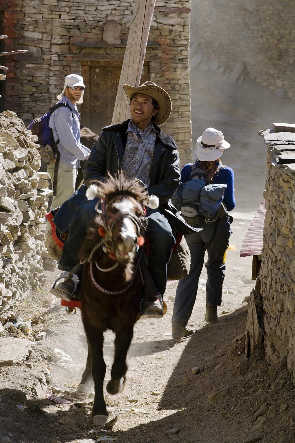 TIBETAN HORSEMAN startles TREKKERS in NAR village - NAR PHU TREK, ANNAPURNA CONSERVATION AREA, NEPAL (MR)