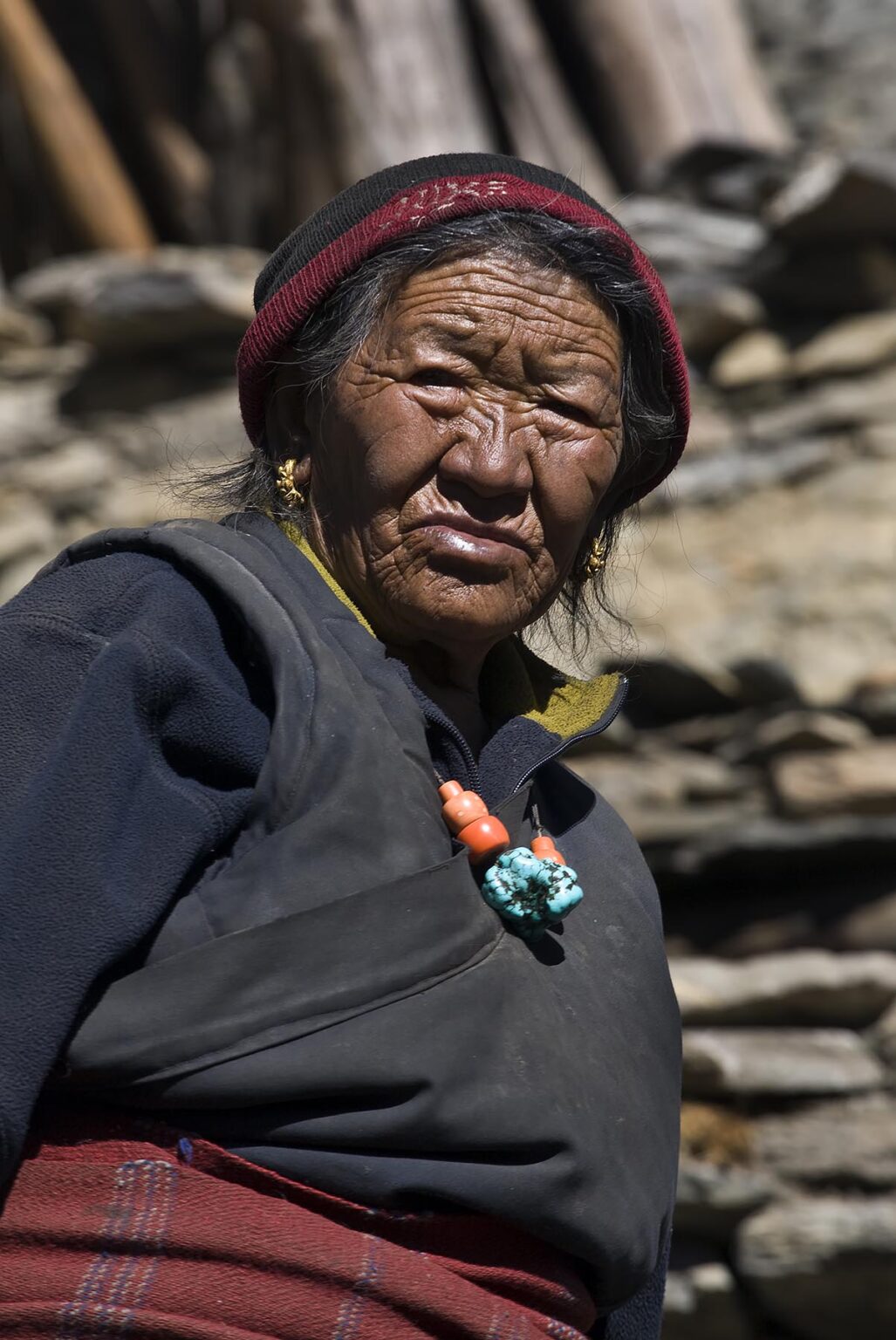 A TIBETAN  ELDER WOMAN in NAR village - NAR PHU TREK, ANNAPURNA CONSERVATION AREA, NEPAL HIMALAYA