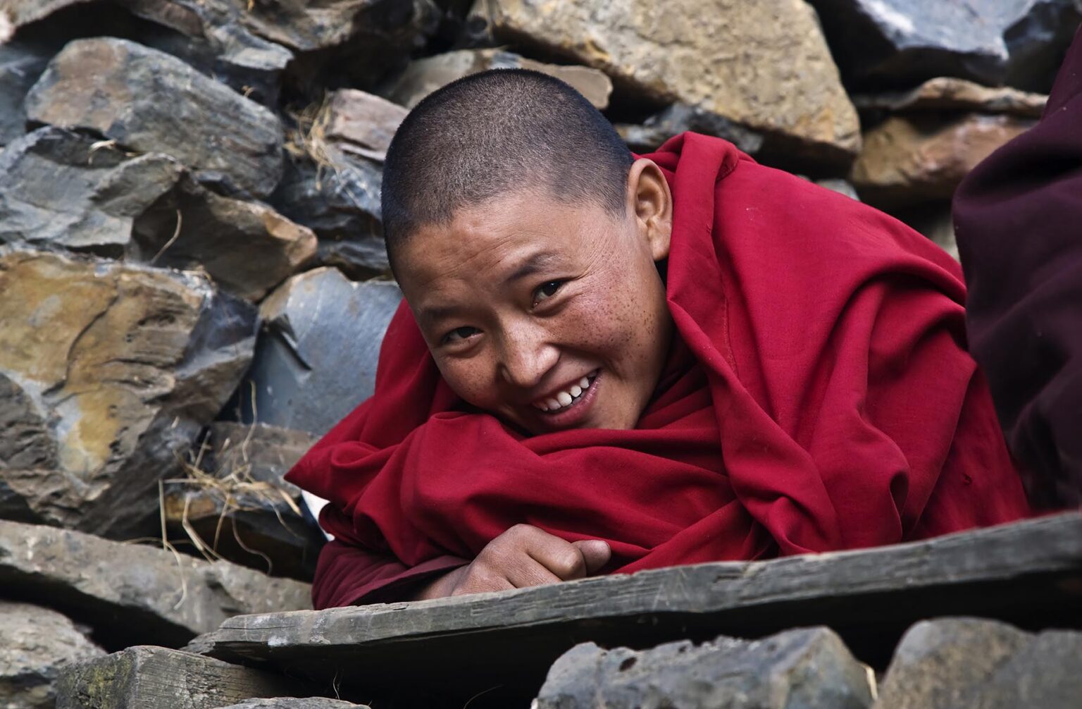 A NUN lives a traditional monastic life studying the dharma at a remote TIBETAN BUDDHIST MONASTERY - NEPAL HIMALALA