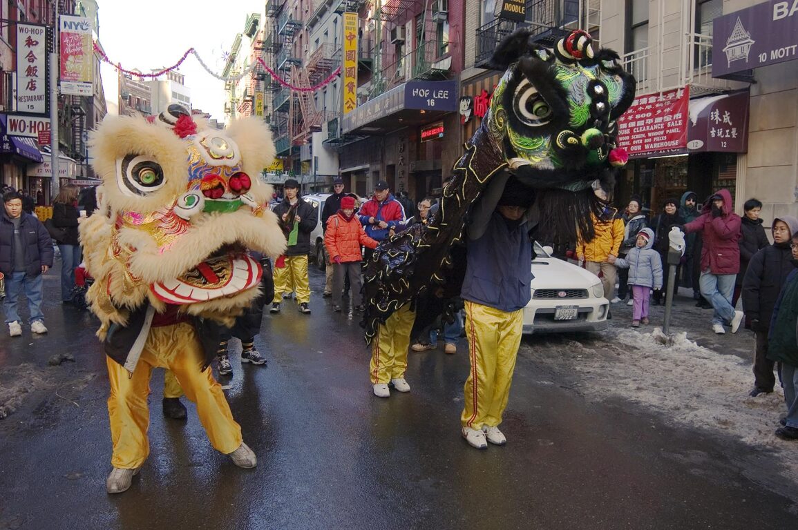 CHINESE NEW YEAR is celebrated with DRAGON PUPPETS in CHINA TOWN for the YEAR OF THE MONKEY - NEW YORK CITY, NEW YORK, USA