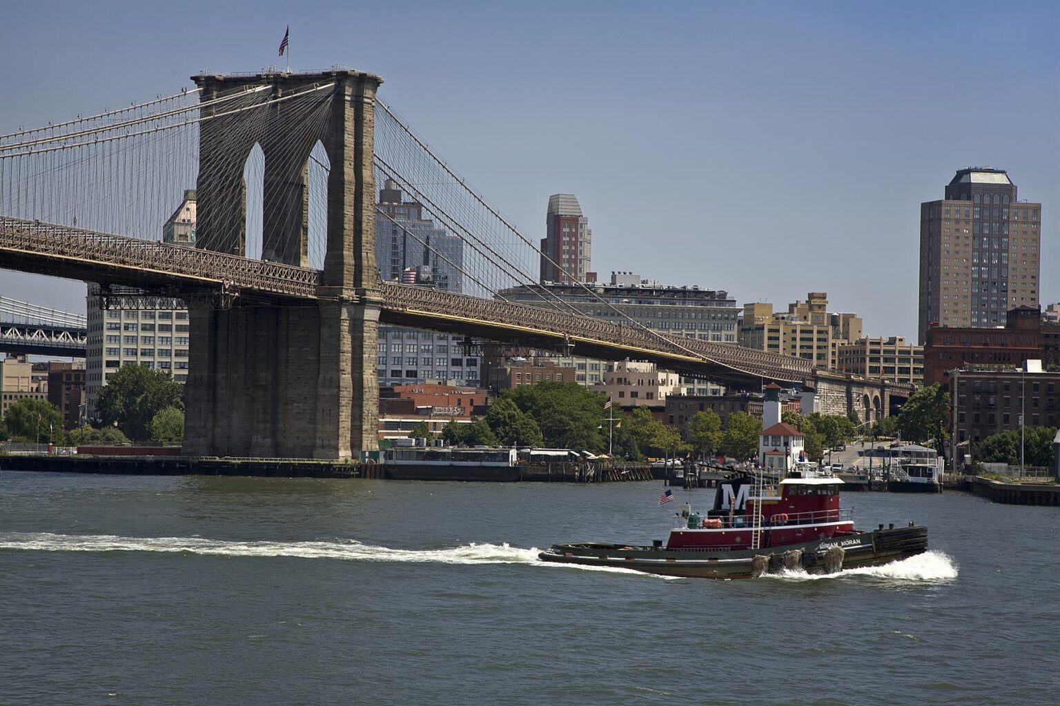 TUGBOAT and eastern tower of the BROOKLYN BRIDGE - NEW YORK CITY