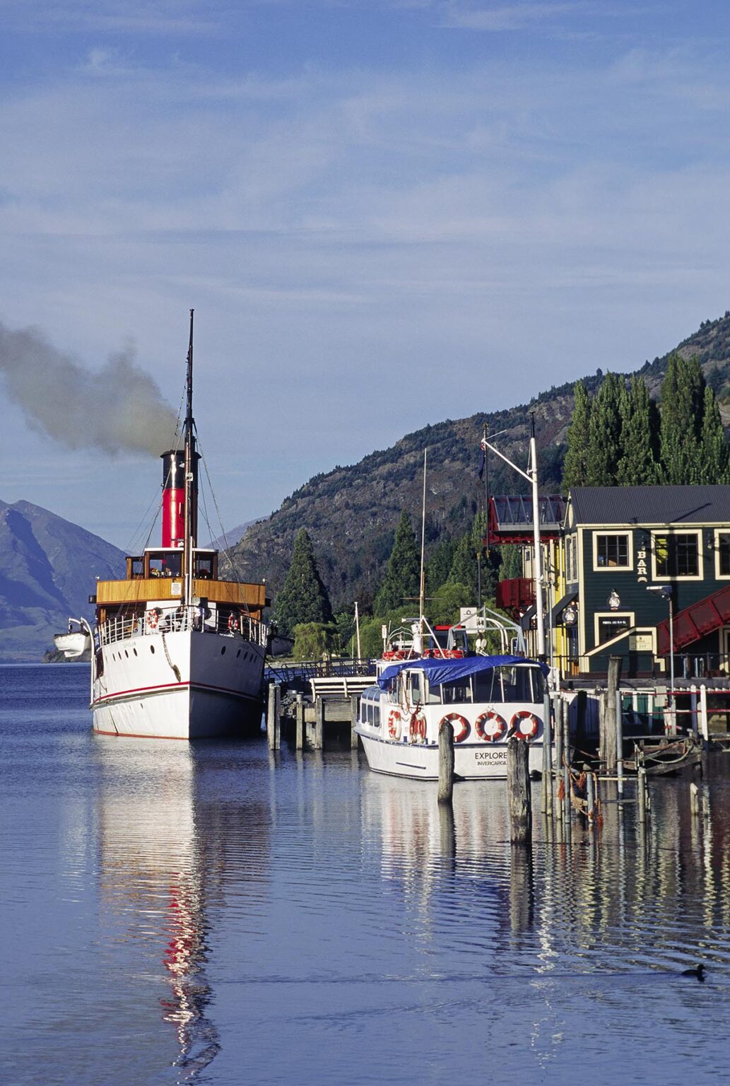 The STEAMSHIP EARNSLAW takes tourists on scenic cruises of LAKE WAKATIPU, and docks in QUEENSTOWN - SOUTH ISLAND, NEW ZEALAND