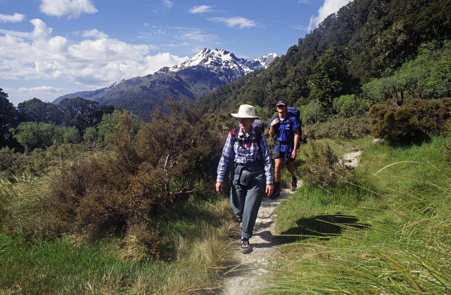 Hikers enjoy a beautiful day along the ROUTEBURN TRACK - FIORDLAND NATIONAL PARK, SOUTH ISLAND