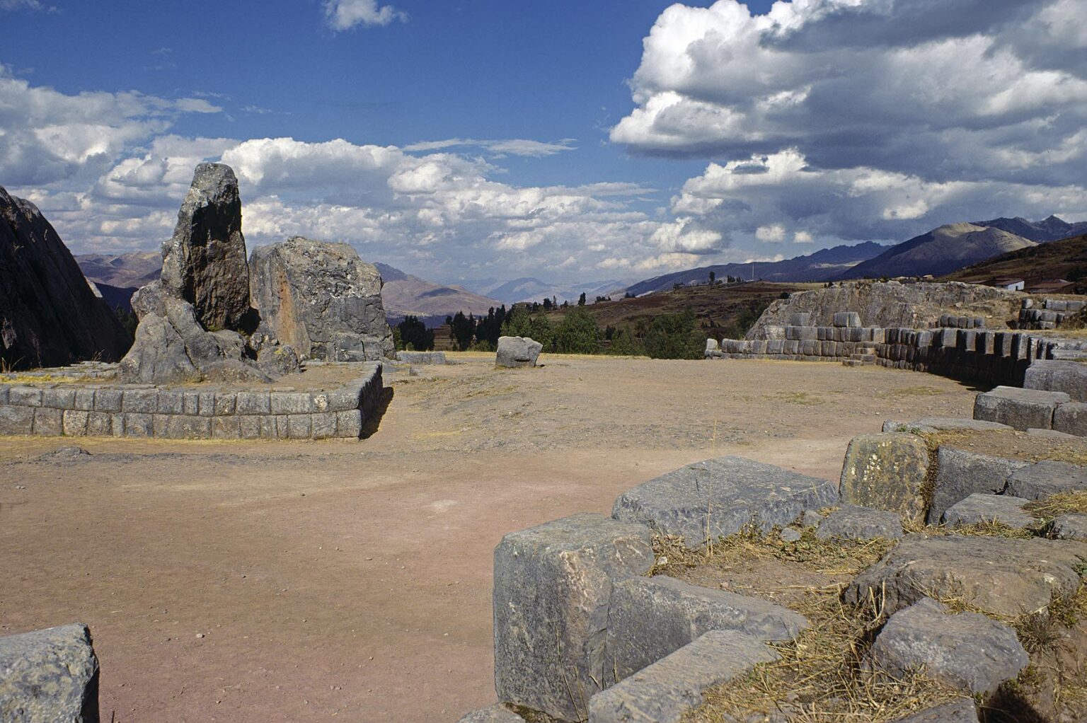 A carved ROCK MONOLITH dominates the INCA RUINS of QUENCO near CUZCO, PERU