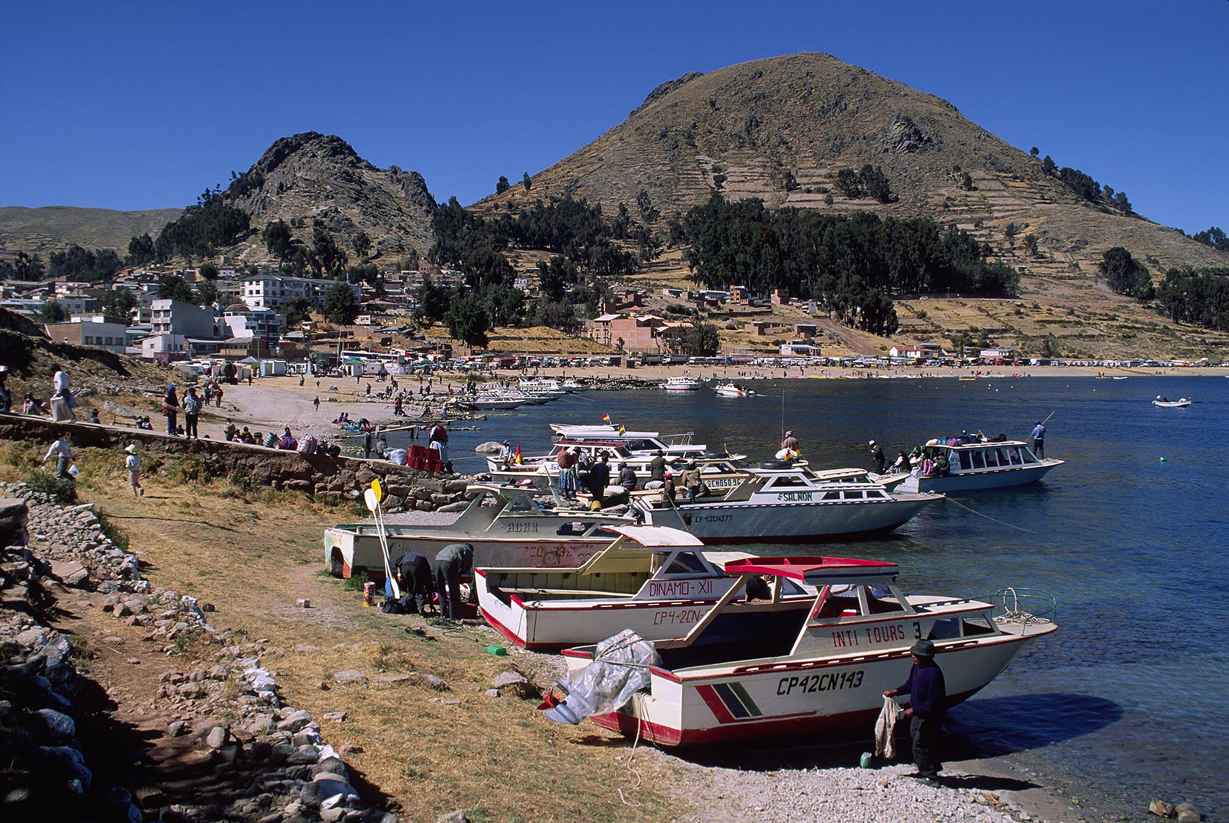 BOATS in the HARBOR and along the shore of COPACABANA - LAKE TITICACA, PERU