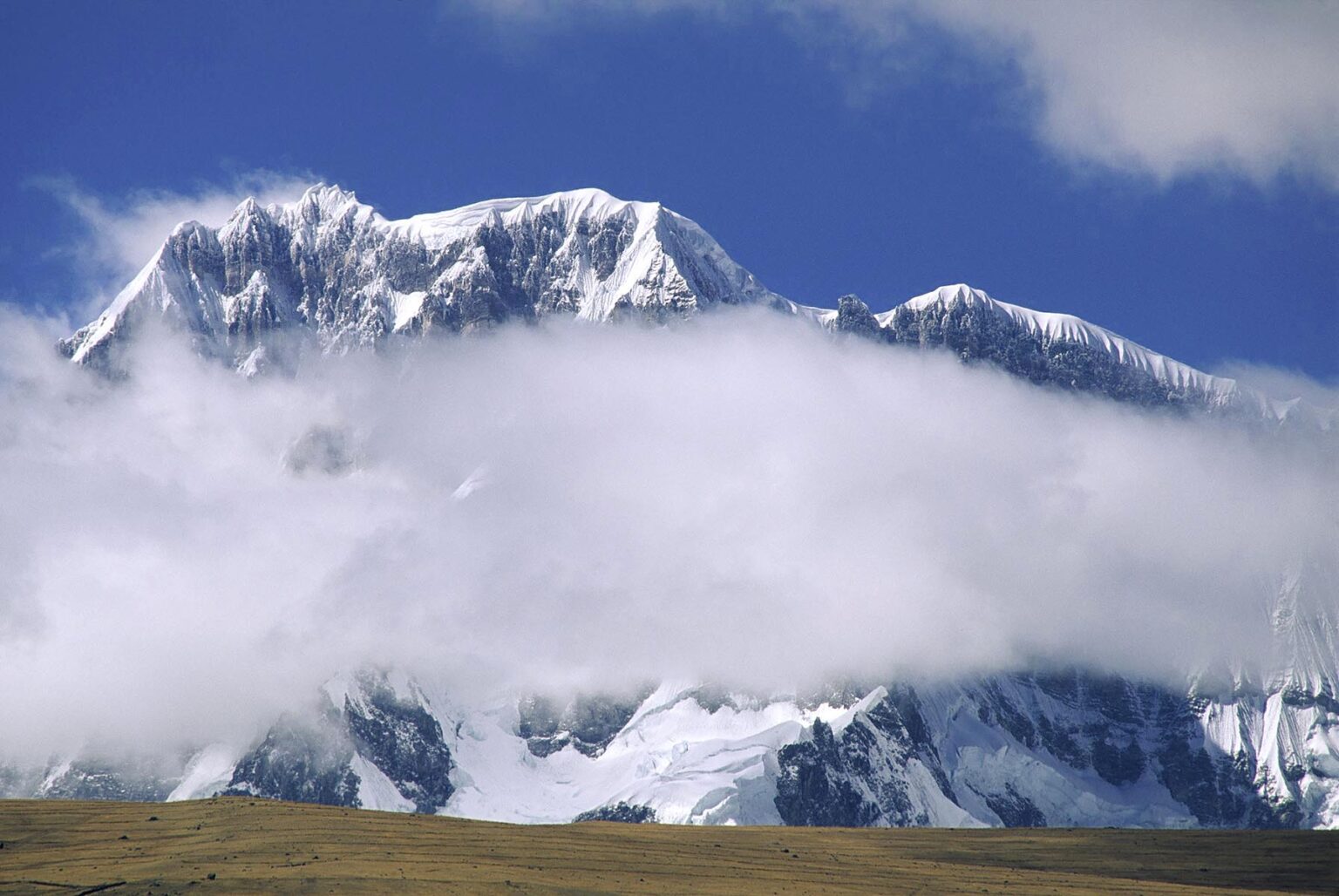 The beautiful & massive NEVADO AUZANGATE rises to a height of 20,900 feet in the PERUVIAN ANDES