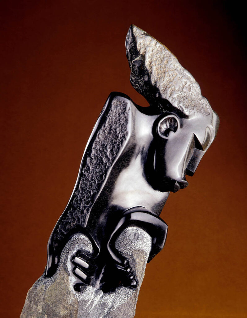 SCULPTURE titled GETTING RID OF MY BURDEN (Opal Stone) by GEDION NYANHONGO - Shona people of Zimbabwe. Product photography by Craig Lovell