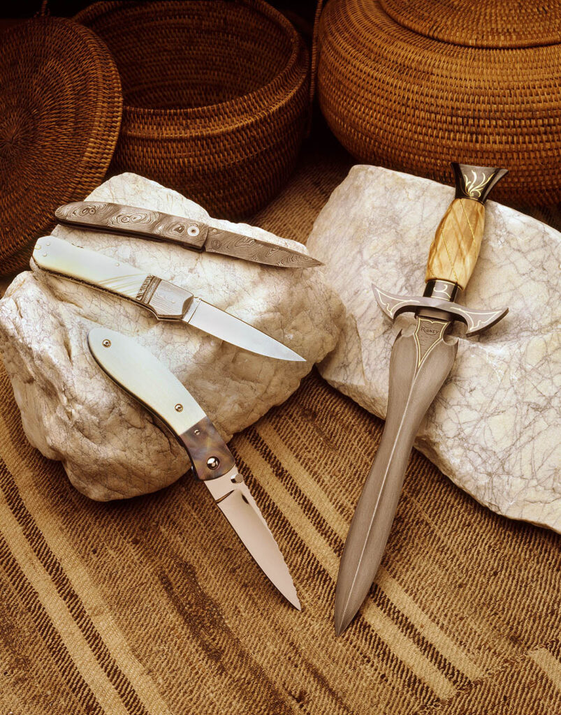 COLLECTABLE KNIVES display on ROCKS photographed for the retail shop Carmel Cutlery.  Commercial studio photograph by Craig Lovell.
