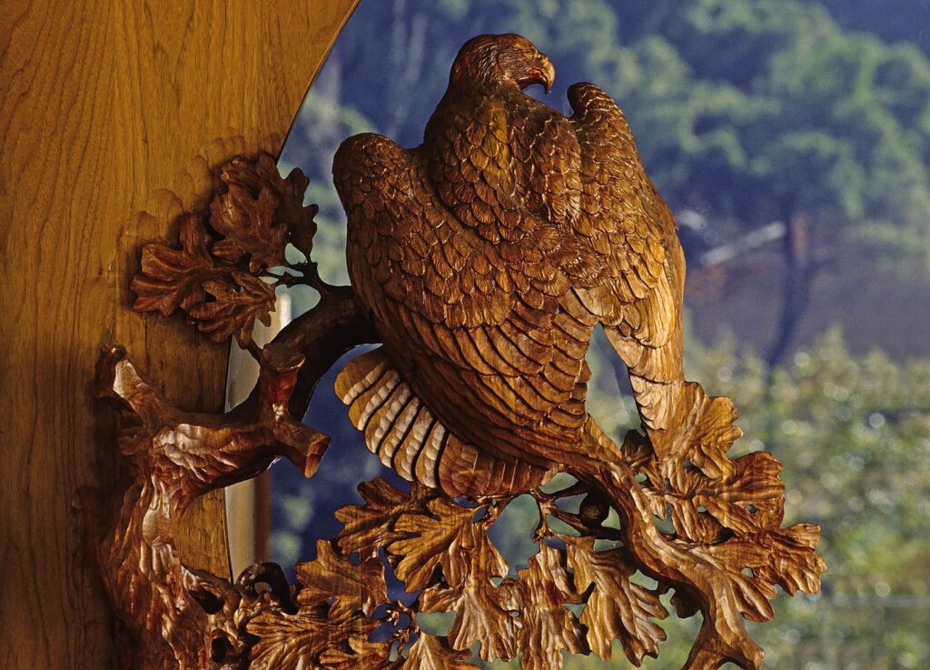 CLOSE-UP of hand carved WOODEN DOORS of GOLDEN EAGLE by the artist WILLIAM SCHNUTE. Product photography by Craig Lovell