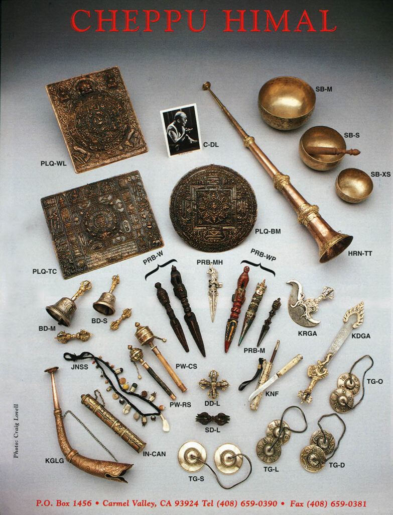 A product catalog photograph of Tibetan ritual objects including a Tibetan horn, singing bowls, purbas, tinkshas,bell and dorje, prayer wheels and Khampa knife.  Still-life by Craig Lovell.