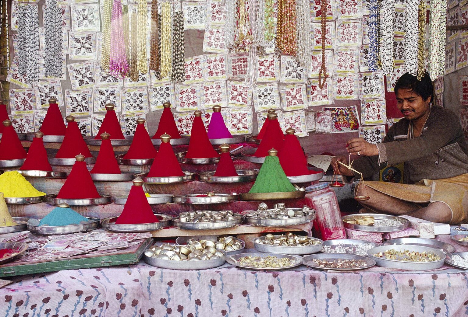 Piles of TIKKA (BLESSING) POWDER in a market stall at the PUSHKAR CAMEL FAIR - RAJASTHAN, INDIA