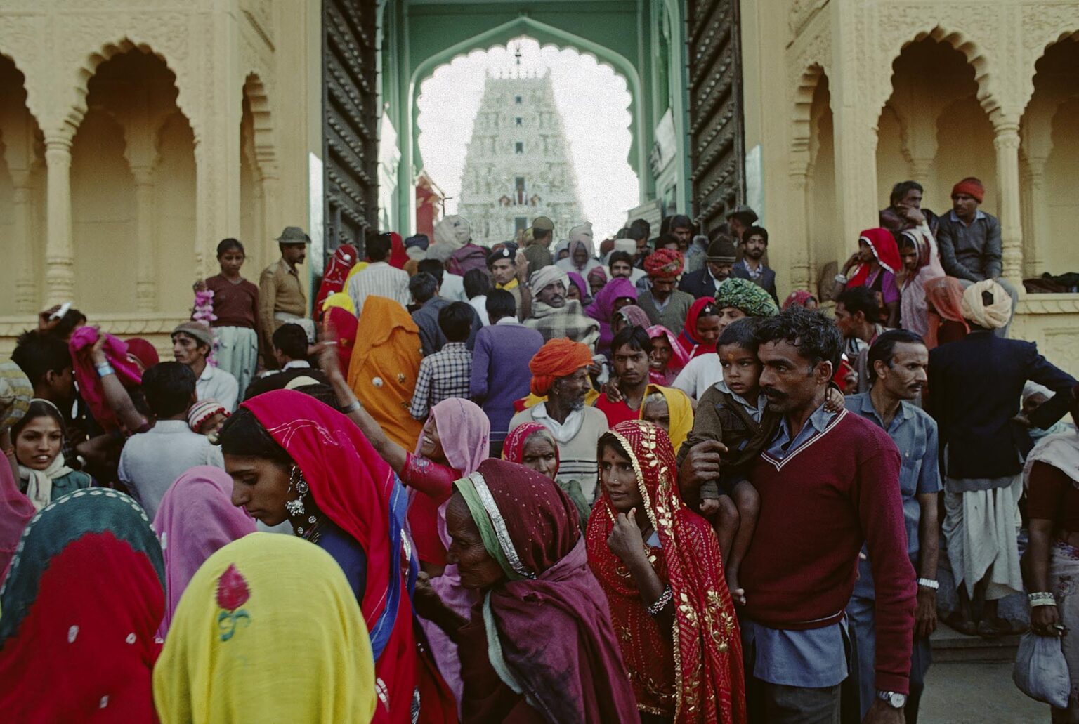 A crowd of RAJASTHANI PILGRIMS enters the RAMA BAIKUNTHA TEMPLE during the PUSHKAR CAMEL FAIR - RAJASTHAN, INDIA
