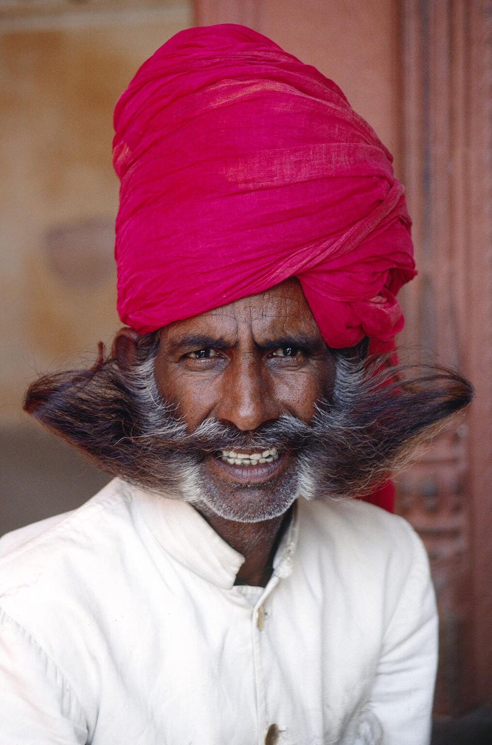 GUARD with RED TURBAN and "soup-strainer" MUSTACHE and BEARD at the CITY PALACE in JAIPUR - RAJASTHAN, INDIA