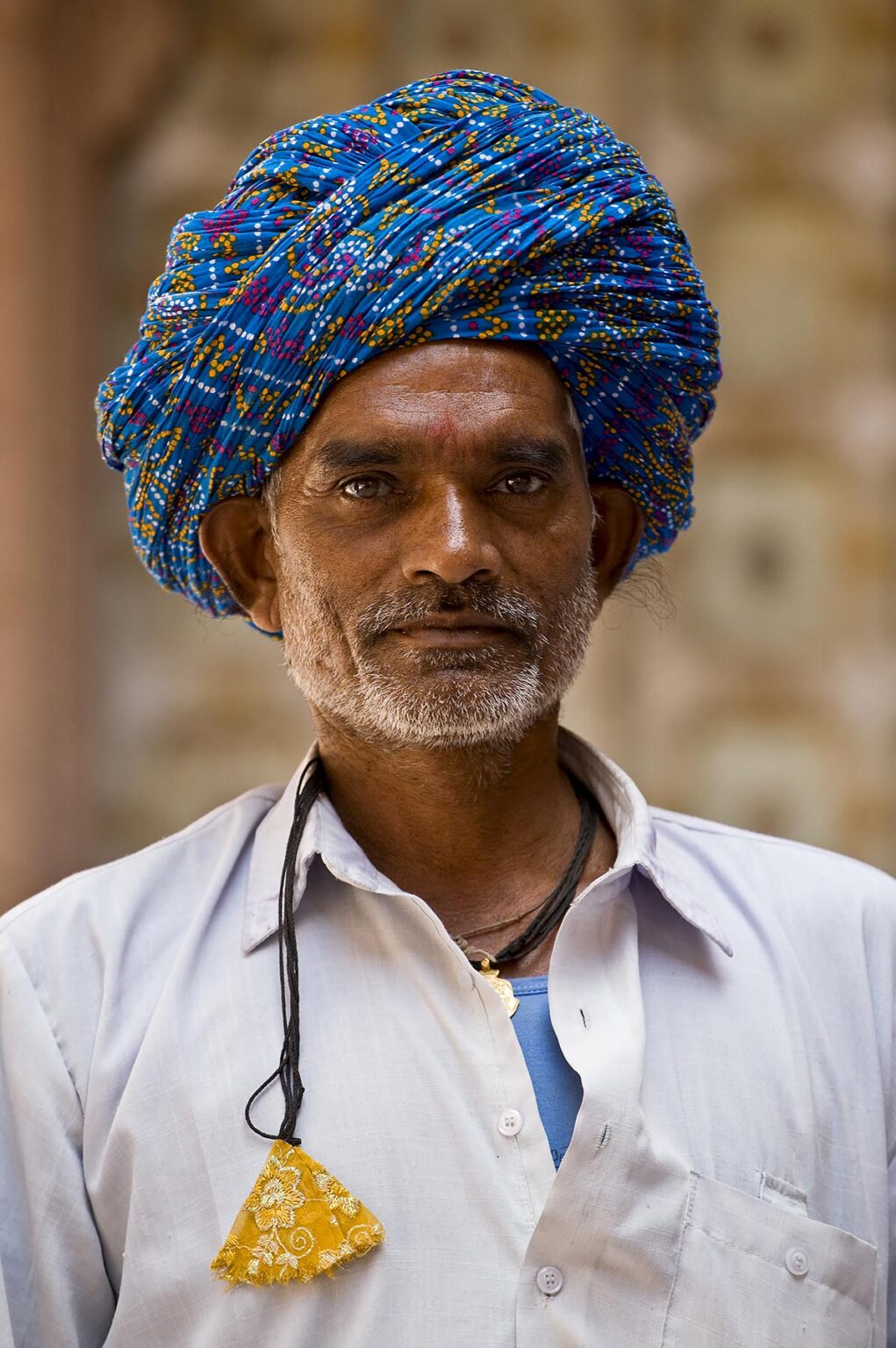 A traditionally turbaned RAJASTHANI MAN in MEHERANGARH FORT - JODHPUR, RAJASTHAN, INDIA